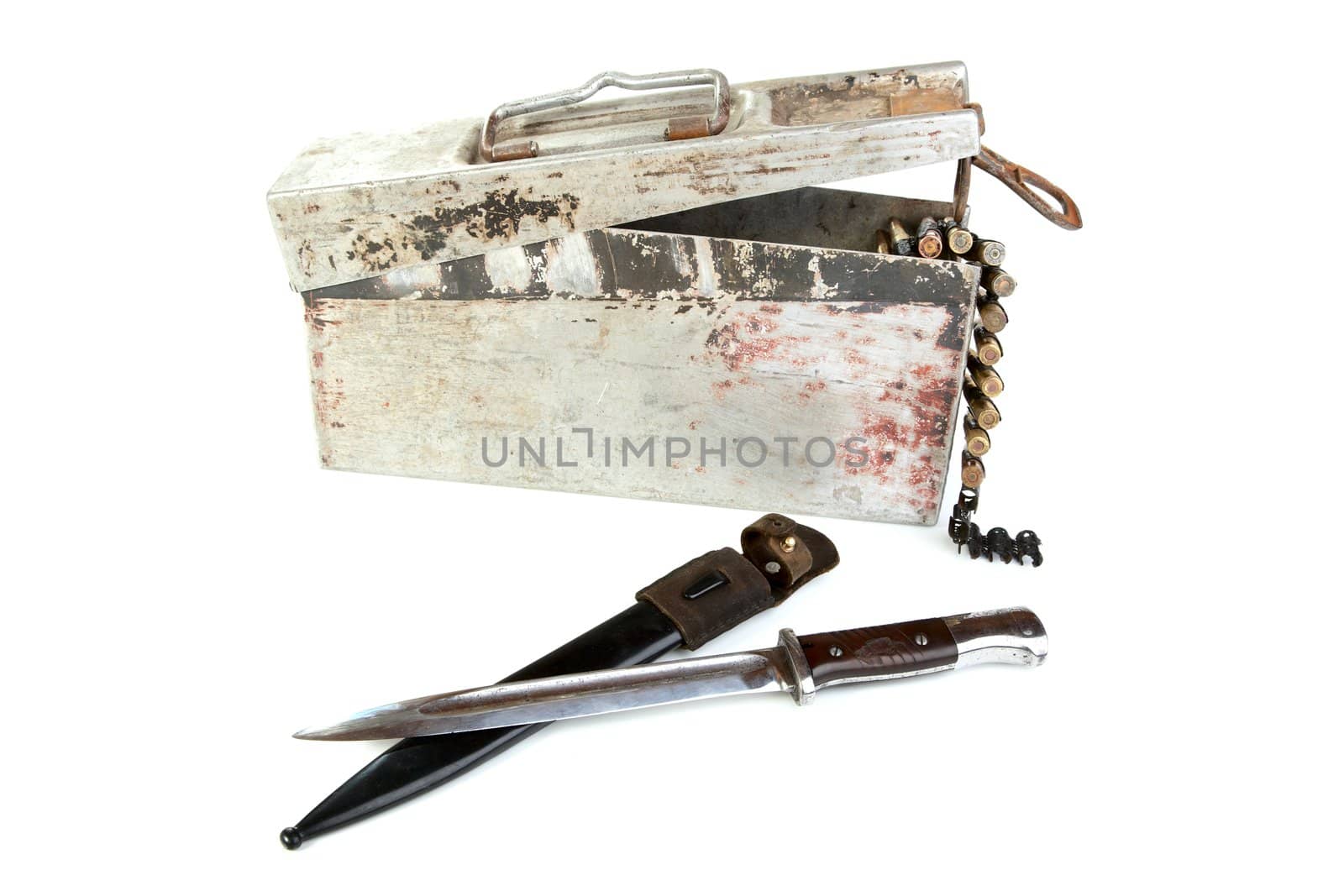 Aluminium box with a machine-gun tape and bayonet-knife on  white background