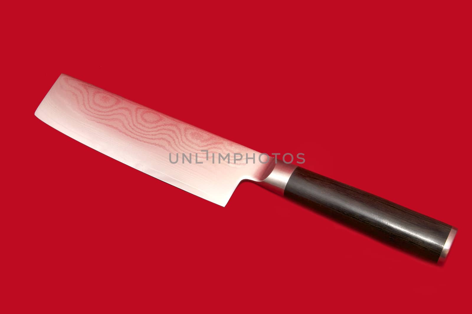 kitchen knife for meat on a red background
