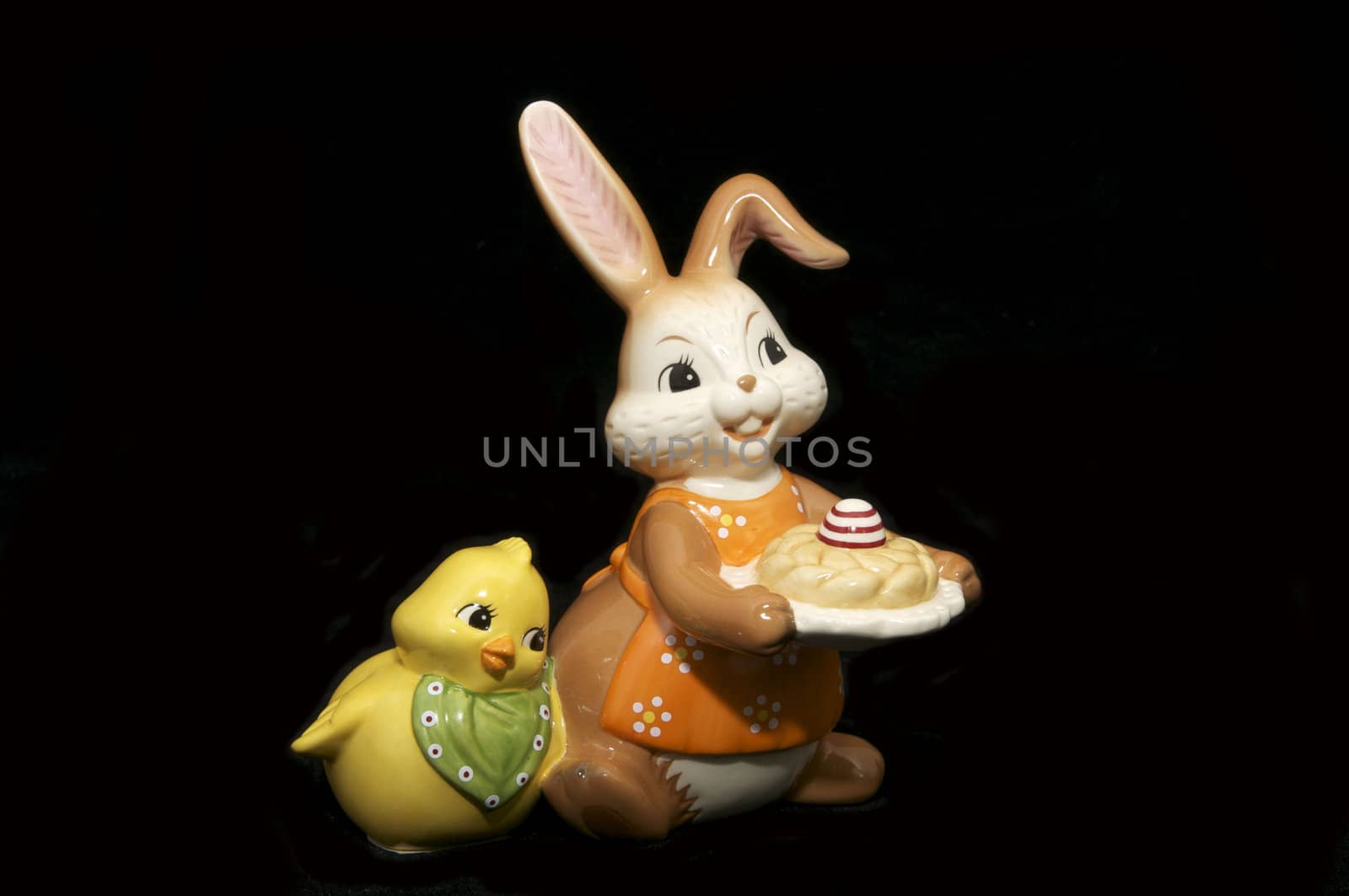 Ceramic Easter Bunny and a chicken on a black background
