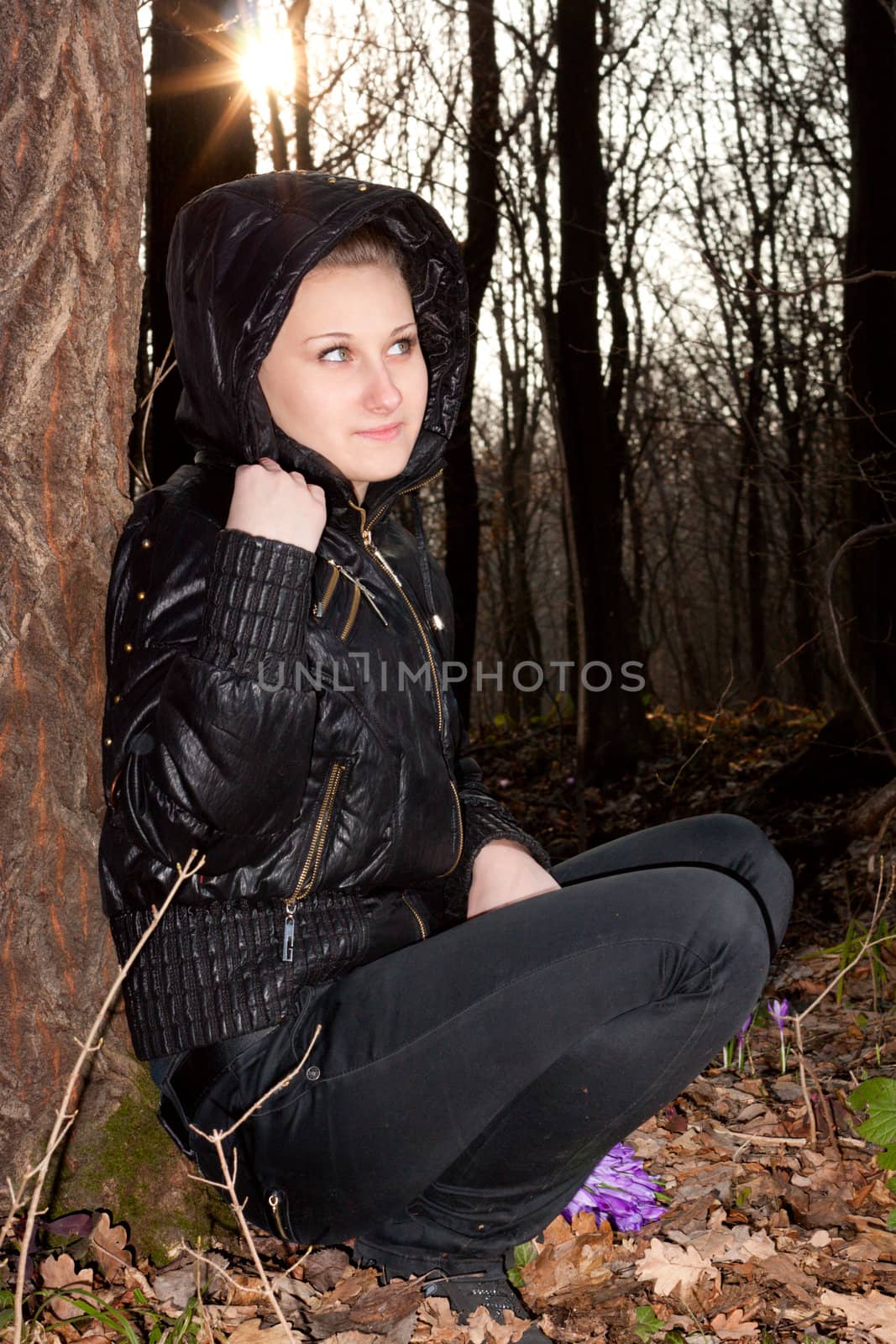 beautiful girl on the background of the spring forest