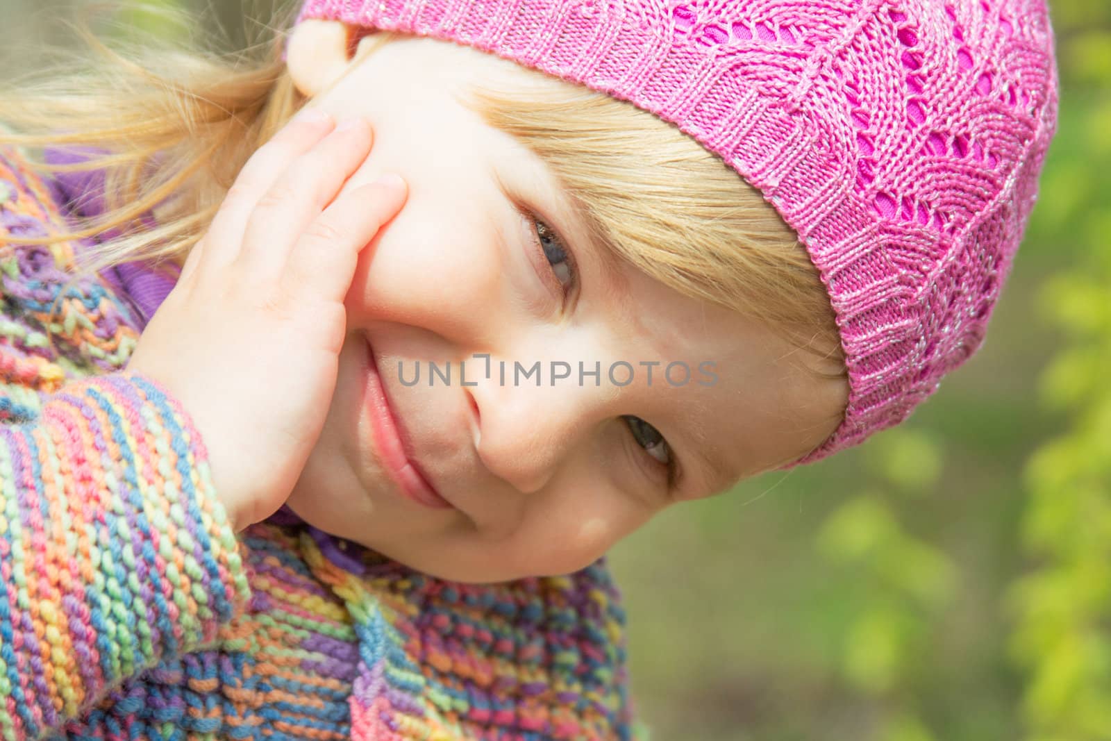 Lovely smiling baby girl face closeup outdoor