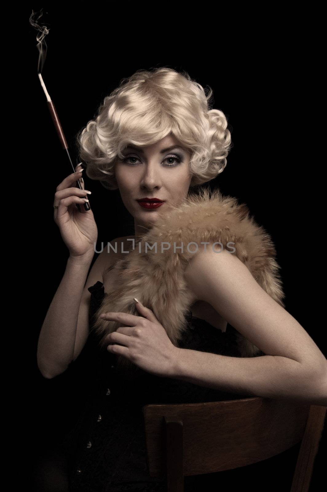 Blond retro-styled woman with cigarette over black