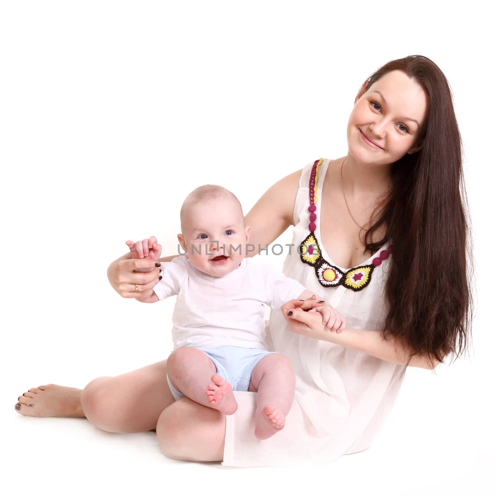 Young mum and the small son, portrait on a white background close up, the kid sits at mum in a lap and smiles. A format square