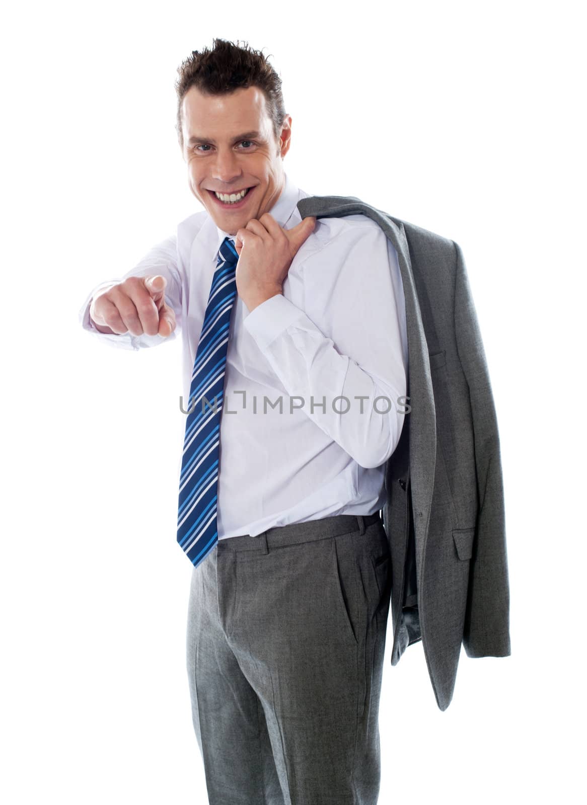 Smiling manager pointing at you. Coat on his shoulders. Isolated on white