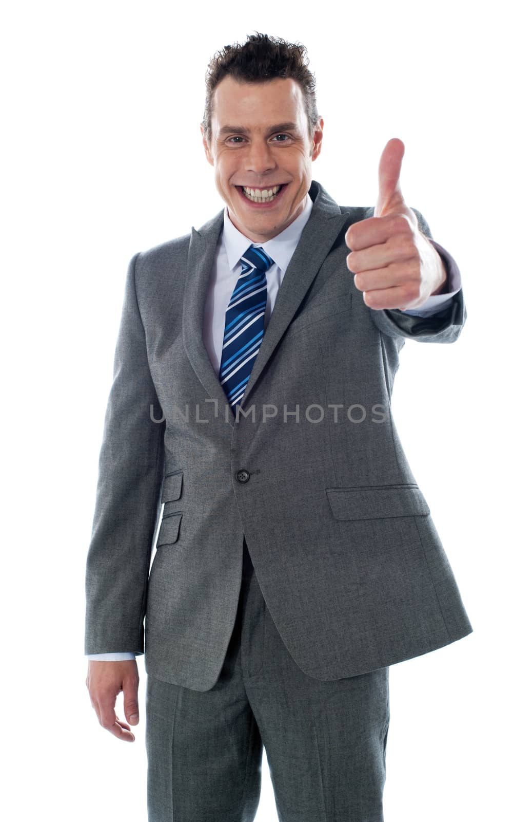 Businessman with thumbs-up by stockyimages