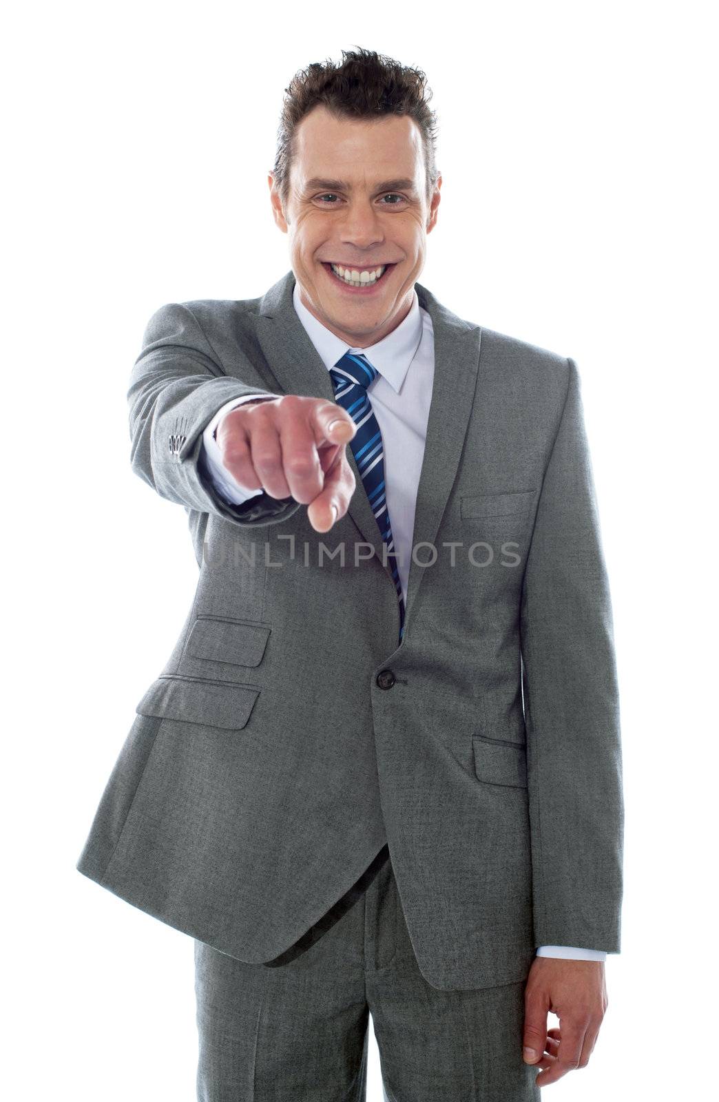 Portrait of businessman pointing at you isolated over white background