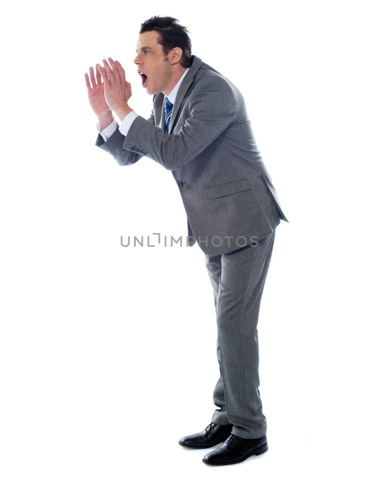 Annoyed executive shouting, isolated by stockyimages