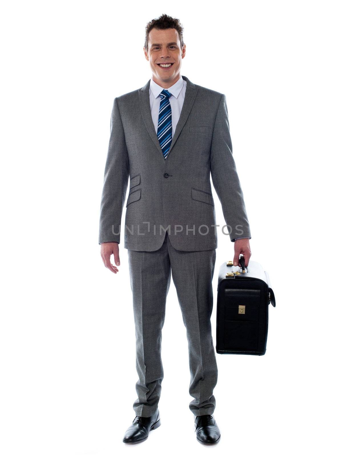 Business executive holding briefcase looking at you