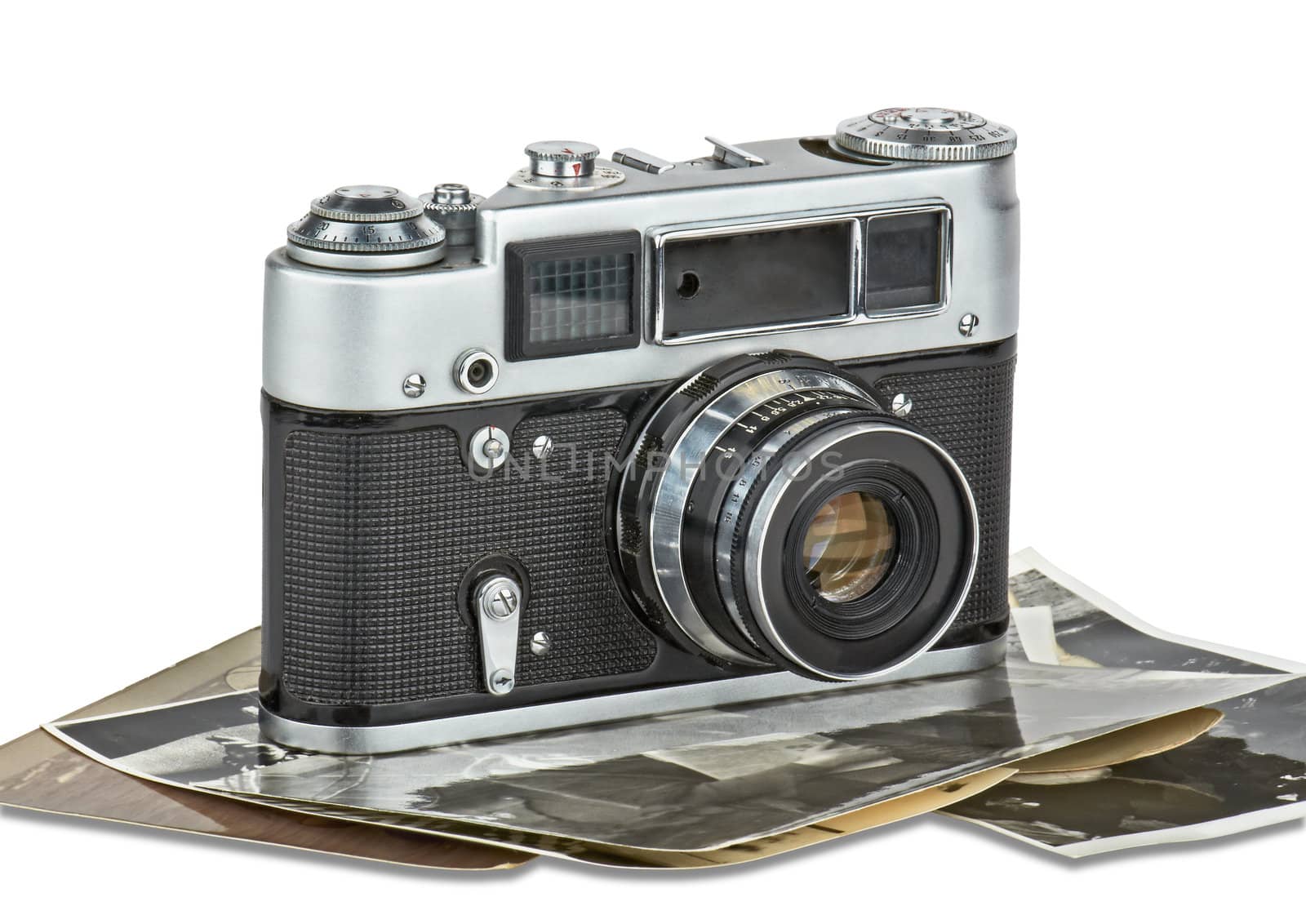 Classic retro a camera on old photos. Image with  light shadow is isolated on white and the file includes a clipping path.