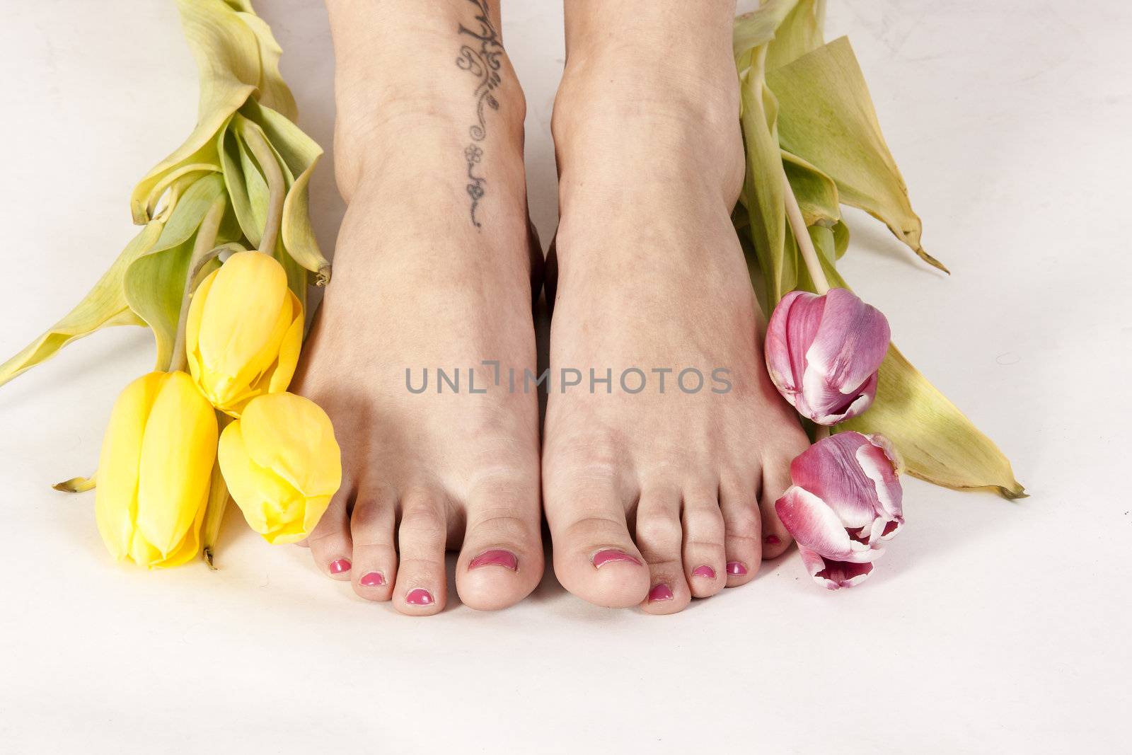 Feet and tulips by STphotography