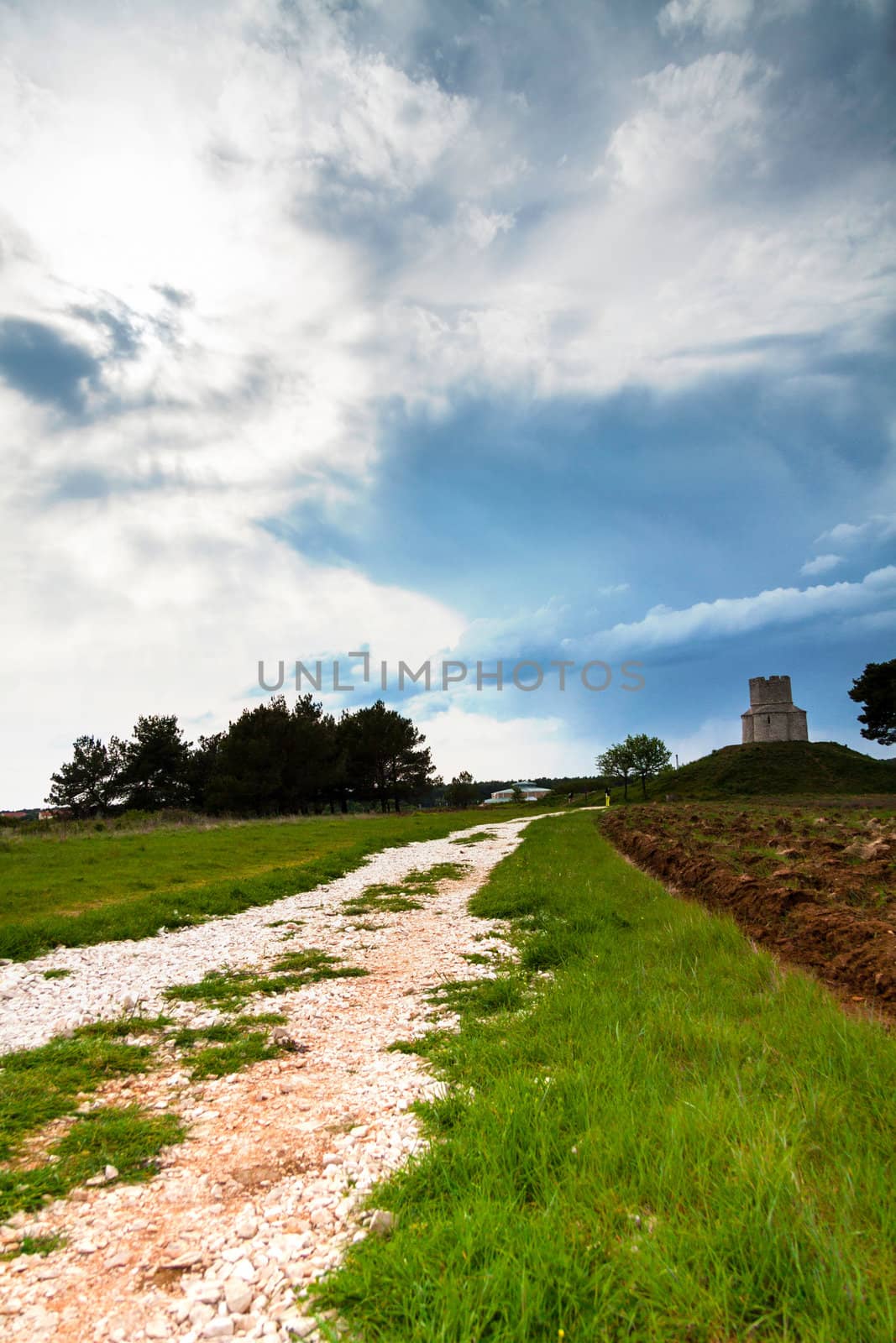 Small church on top of a hill with clouds by Lamarinx