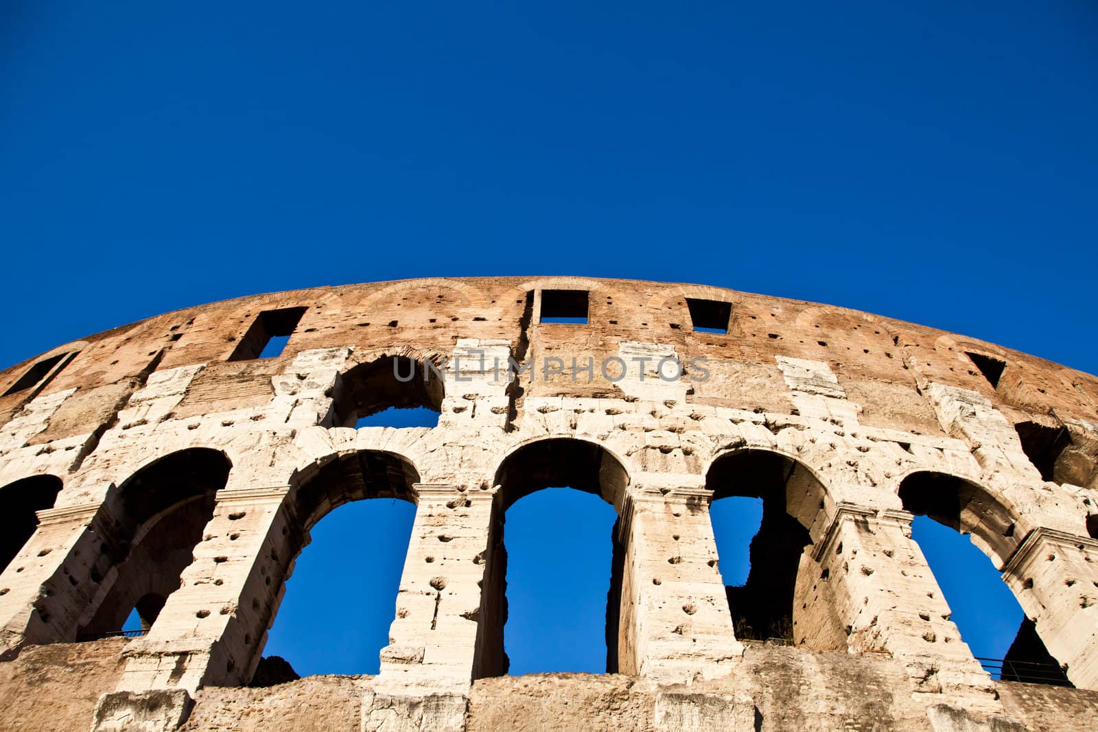 Colosseum in Rome with blue sky, landmark of the city