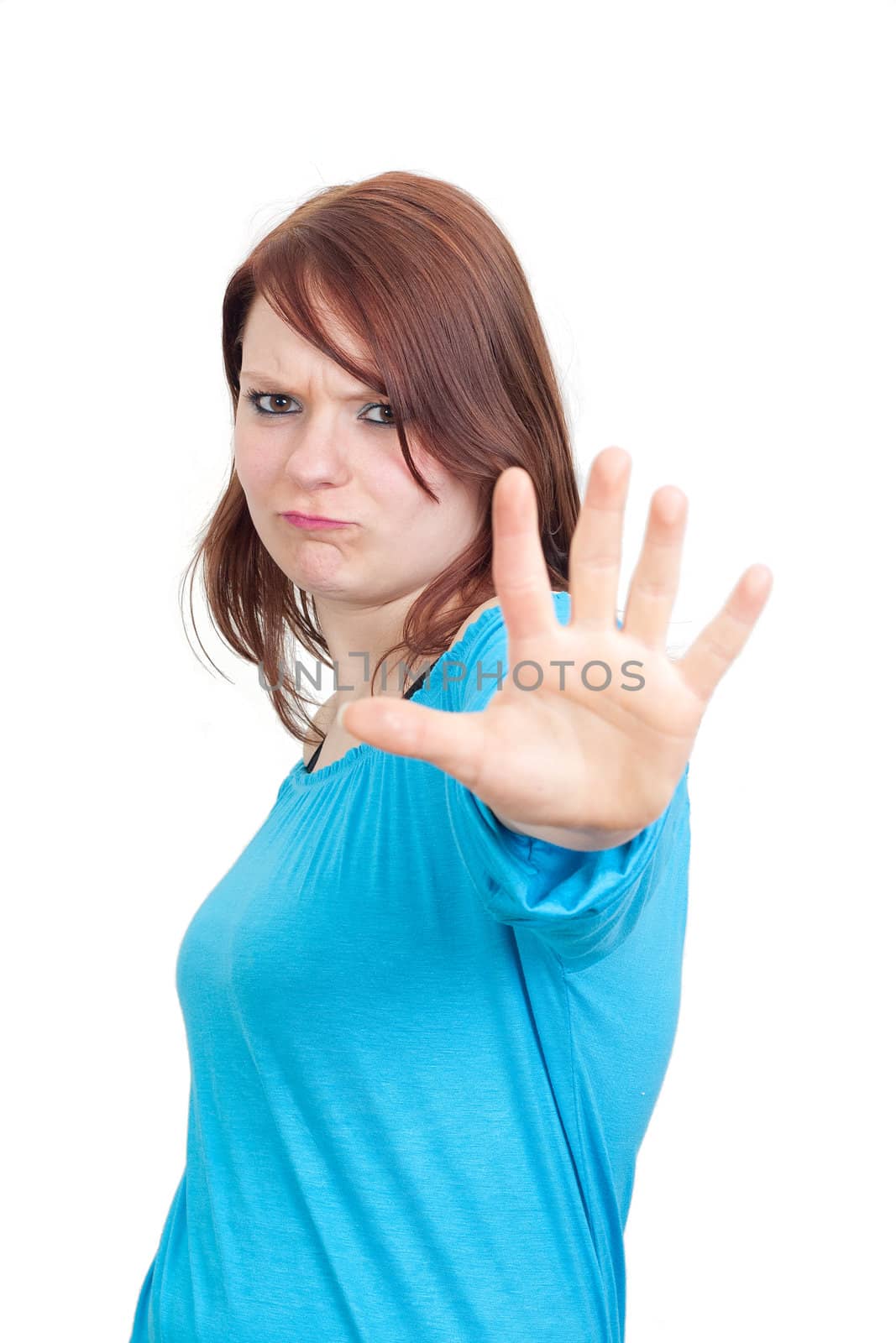 Young woman making Stop gesture