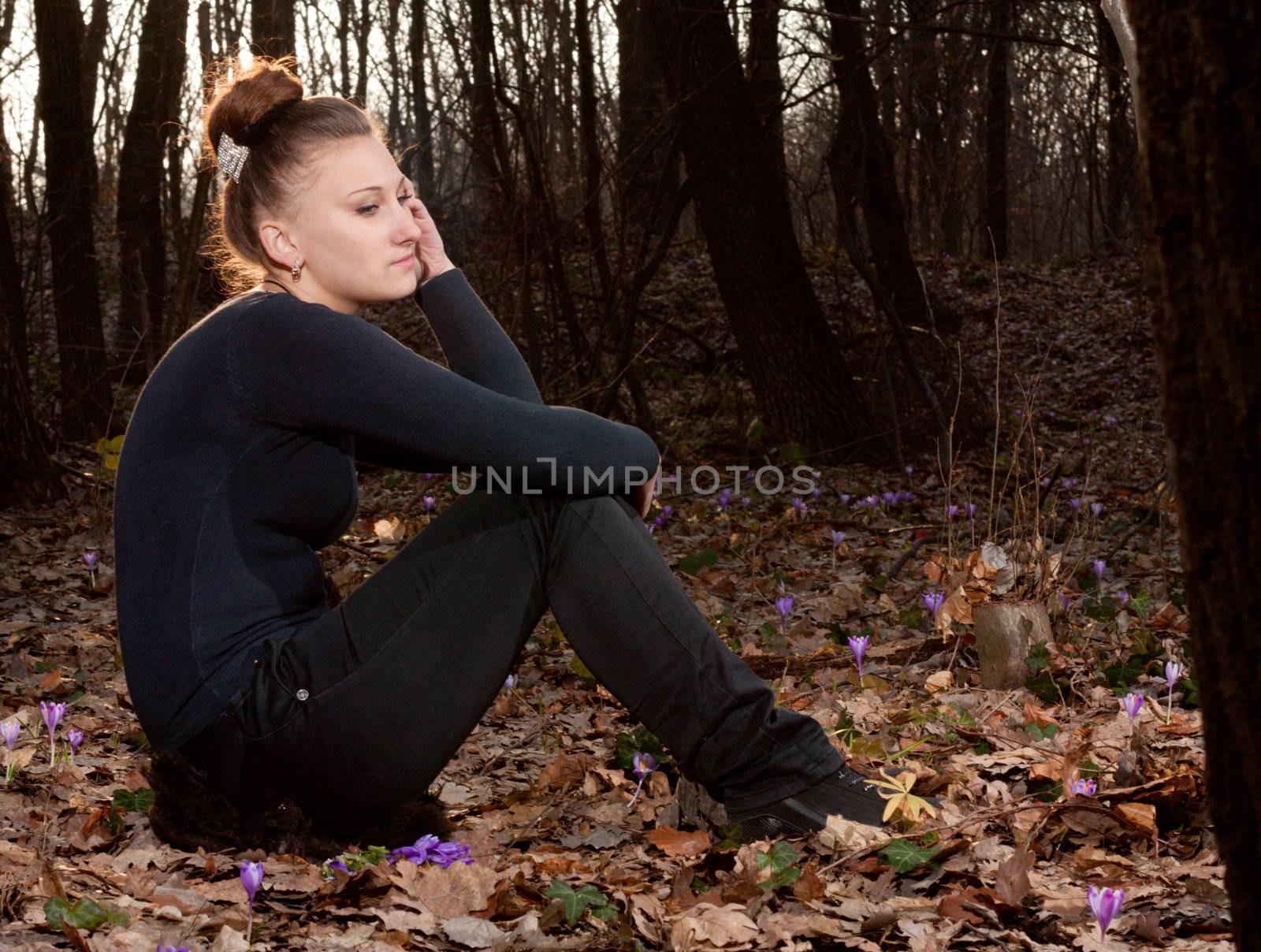 beautiful girl on the background of the spring forest