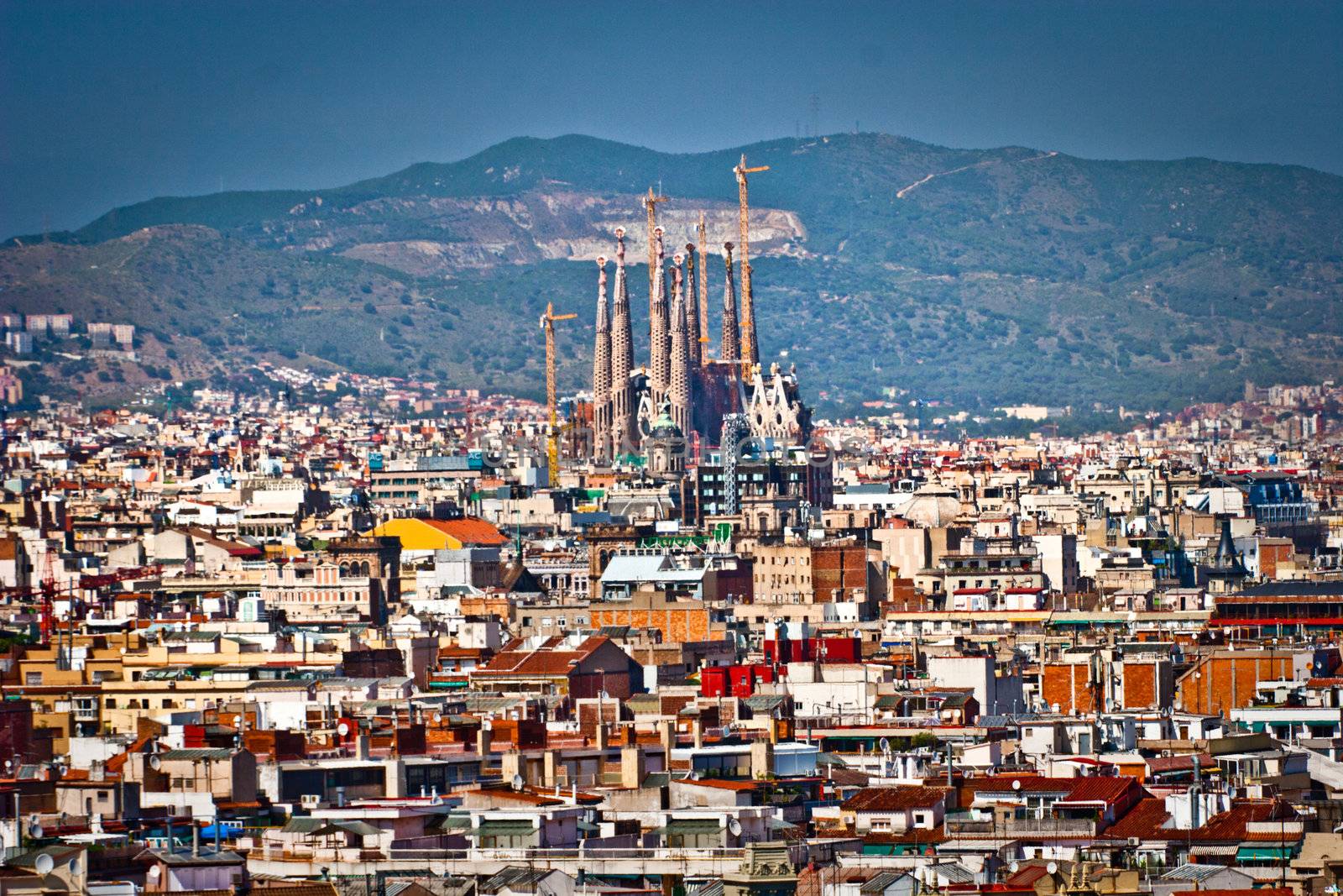 View over the rooftops of Barcelona in Spain showing the Roman Catholic church of Sagrada Familia