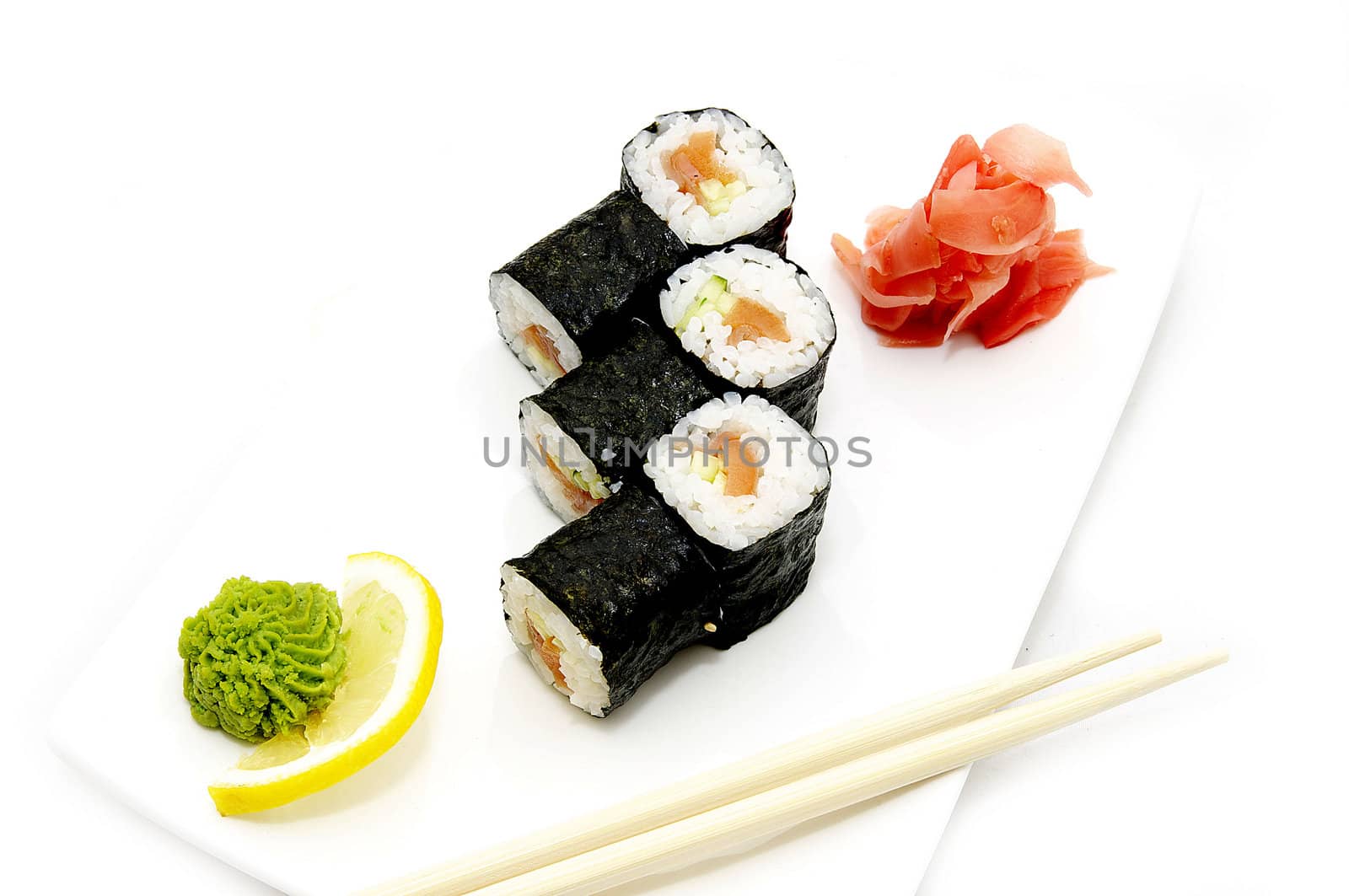 Sushi on a plate with chopsticks on a white background