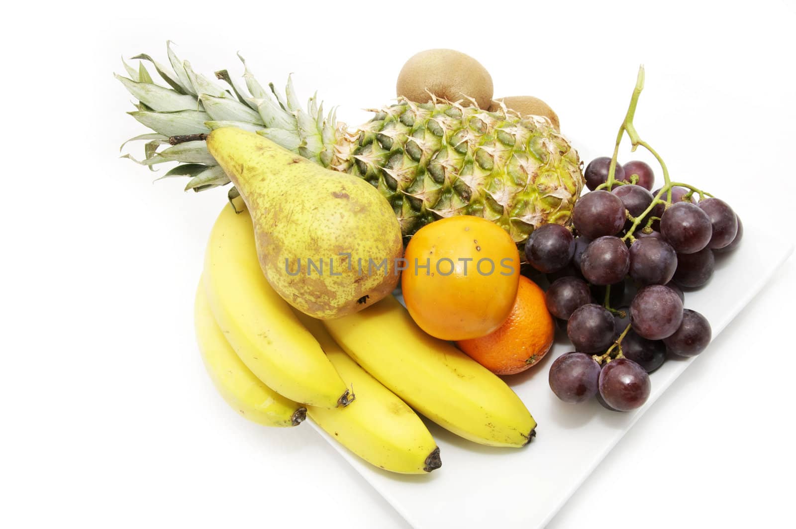 plate with whole fruits on a white background