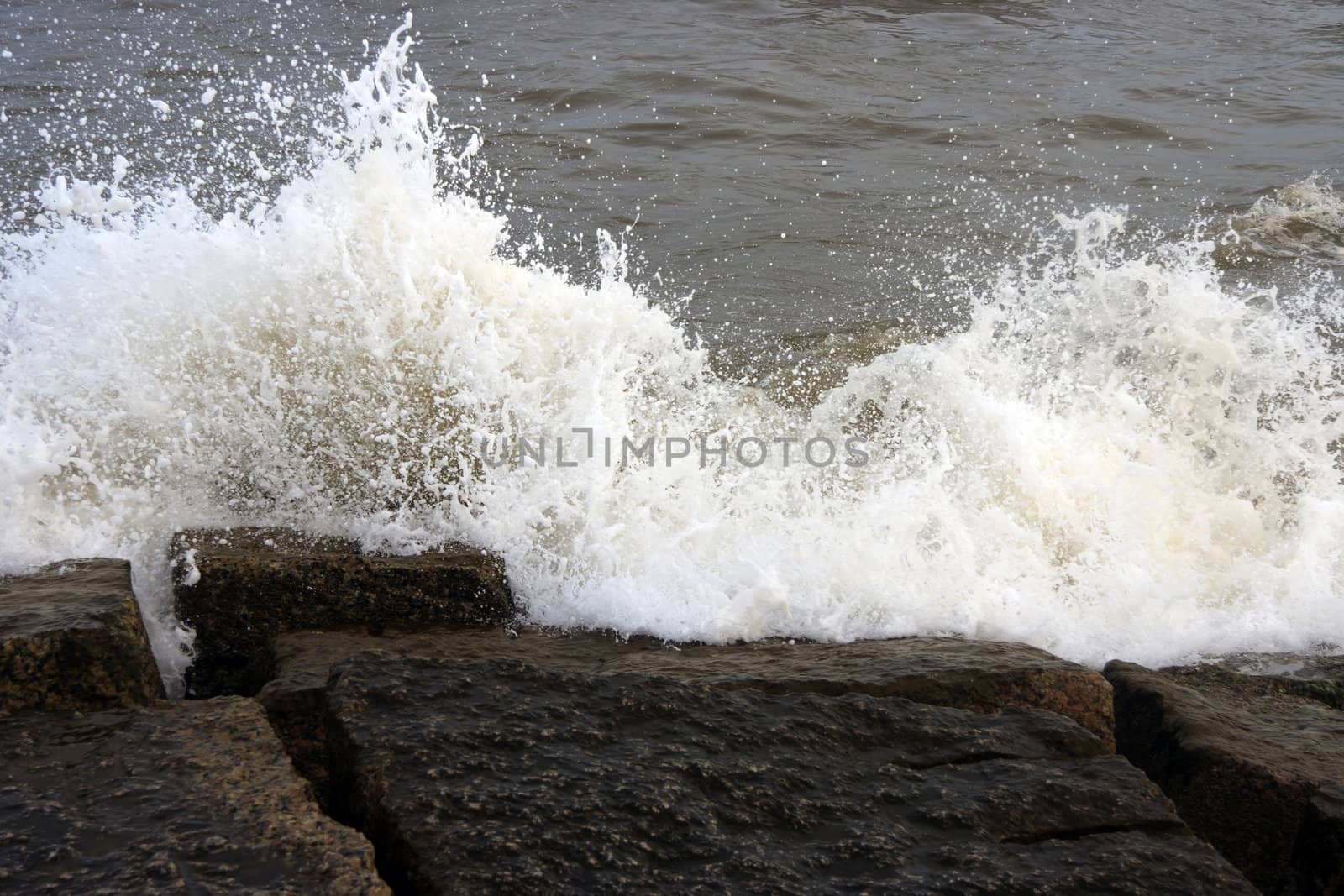 Ocean waves crashing onto some rocks