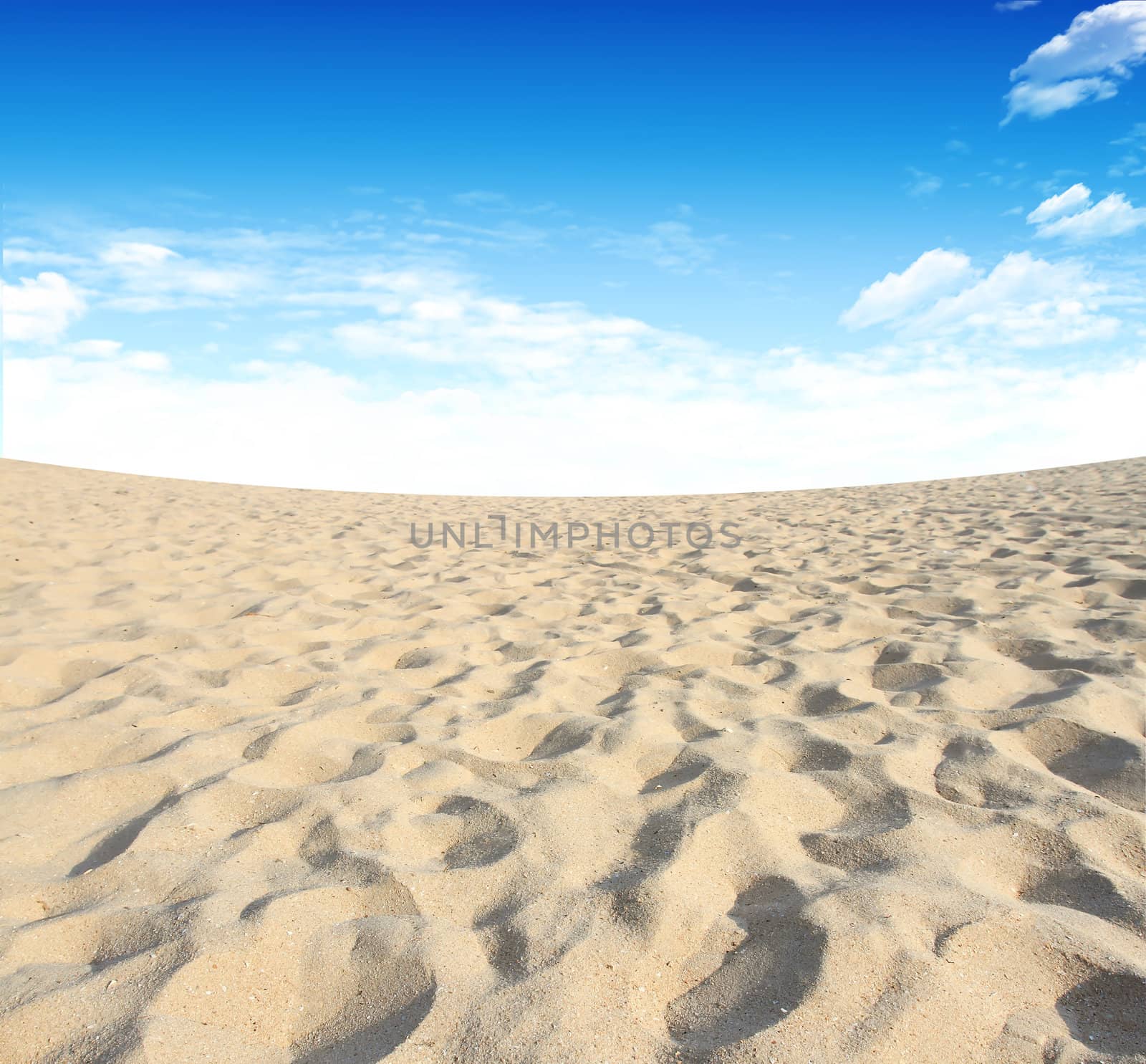 Sand and sky with clouds and sun background