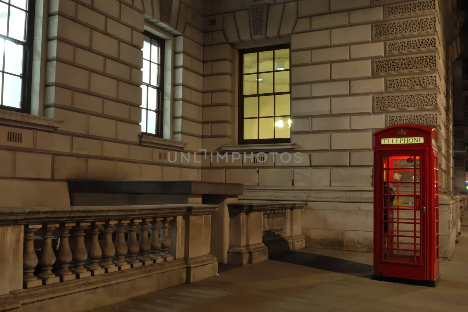 Red telephone box by night