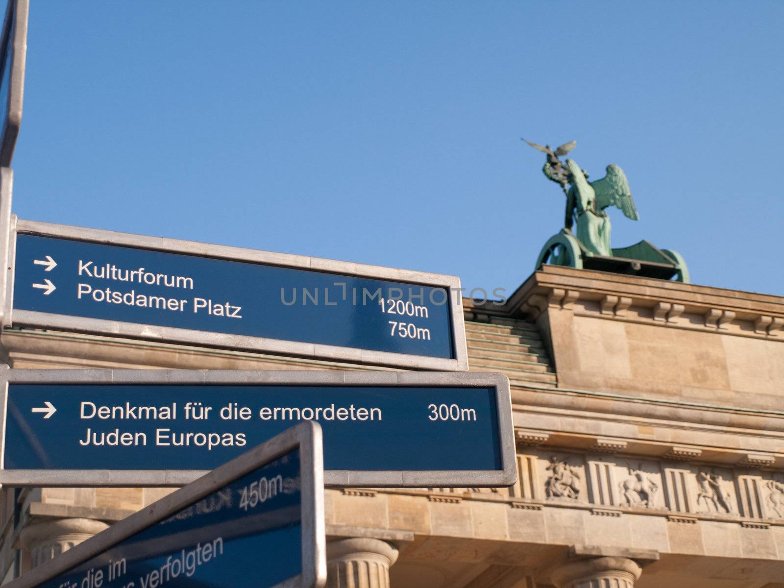 Direction Sign by Brandenburg Gate in Berlin Germany