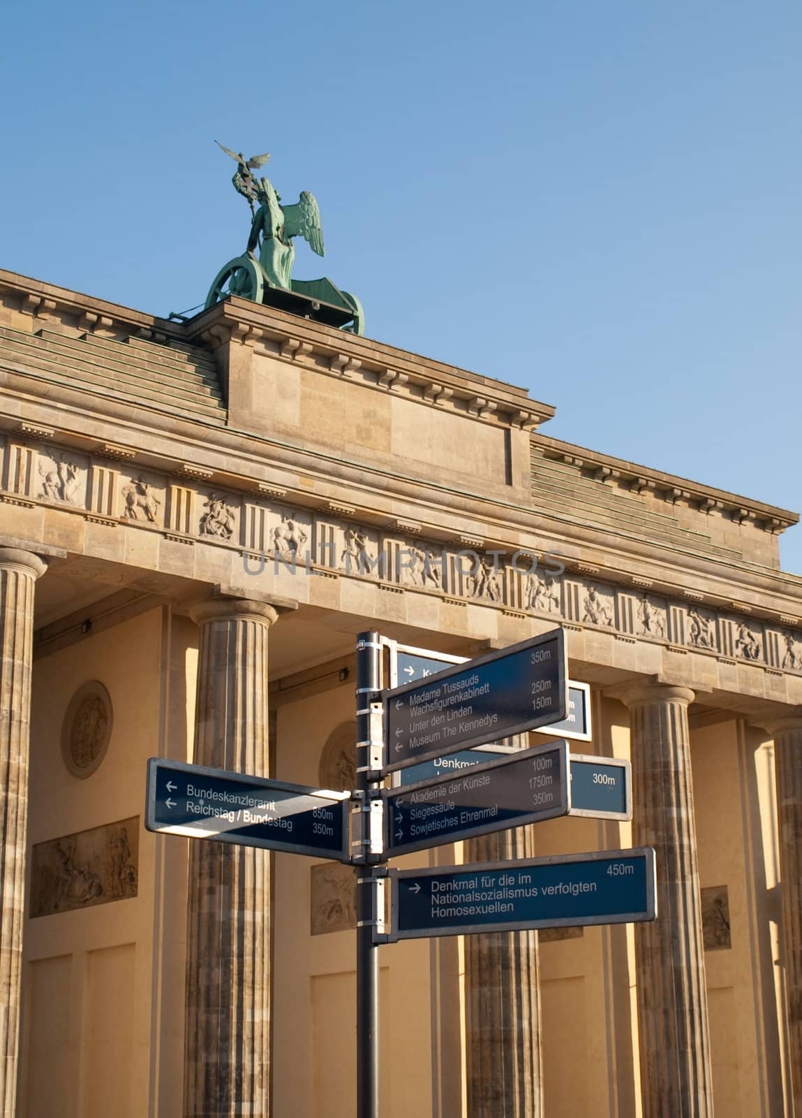 Direction Sign by Brandenburg Gate in Berlin Germany