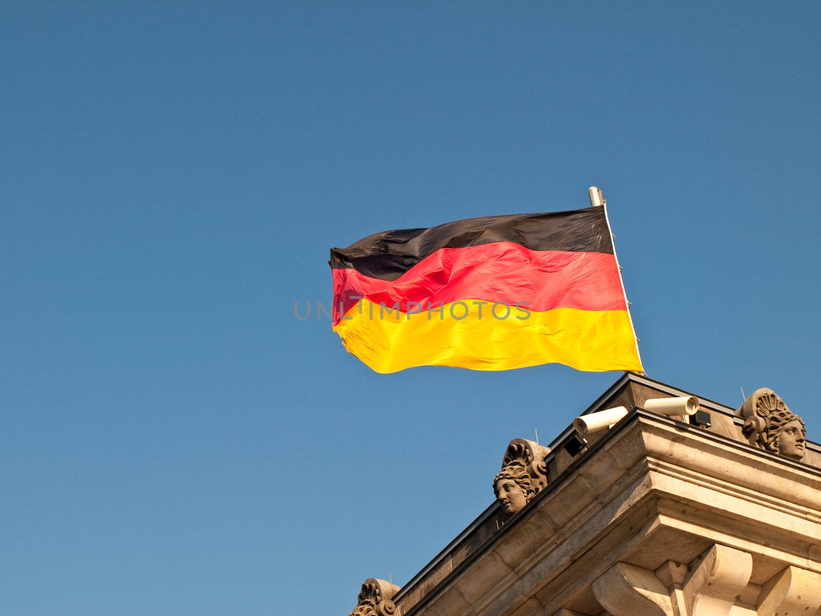 German Flag Flying over Reichstag Bundestag Building, Berlin Germany