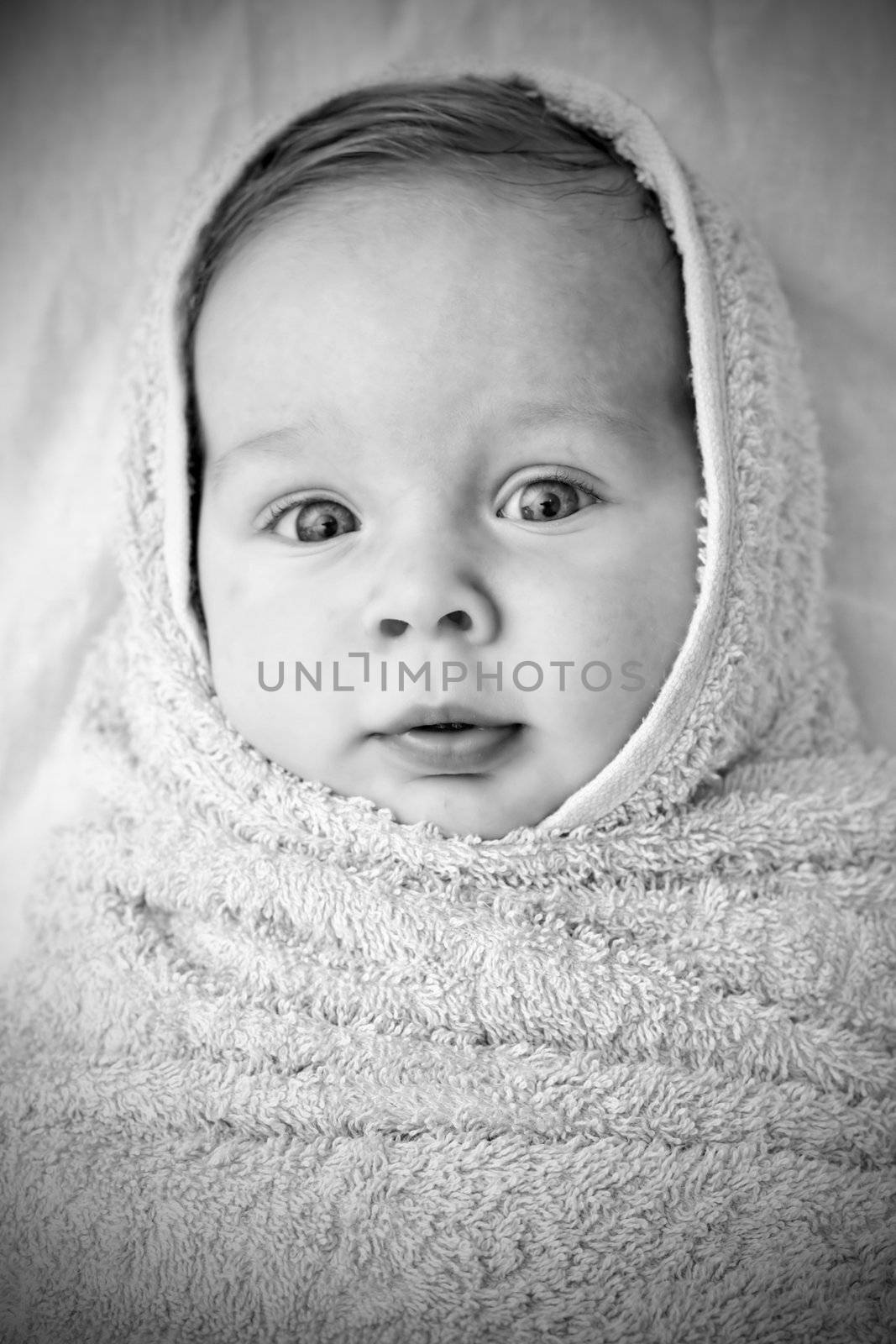 portrait of a smiling baby in a  fabric
