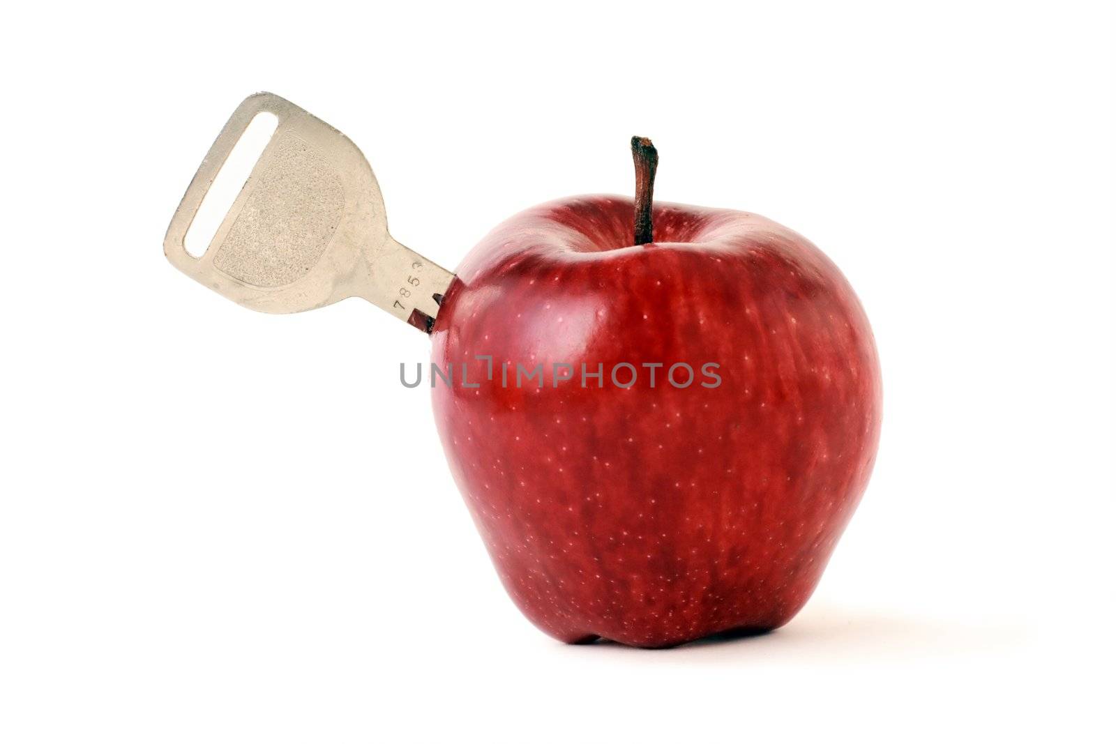 key is inserted into the fruit, apple