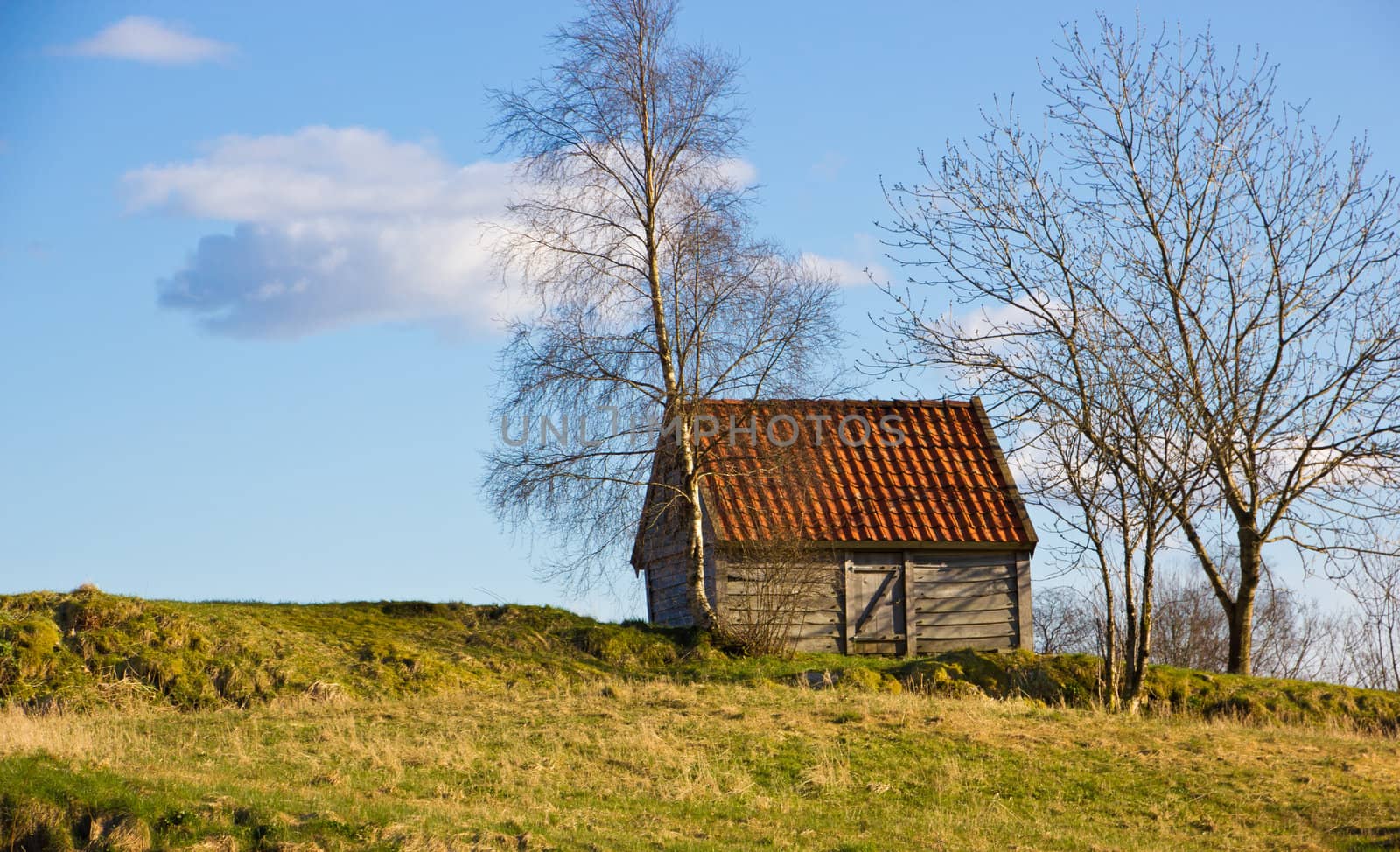 Picture of a small house on the top of a hill