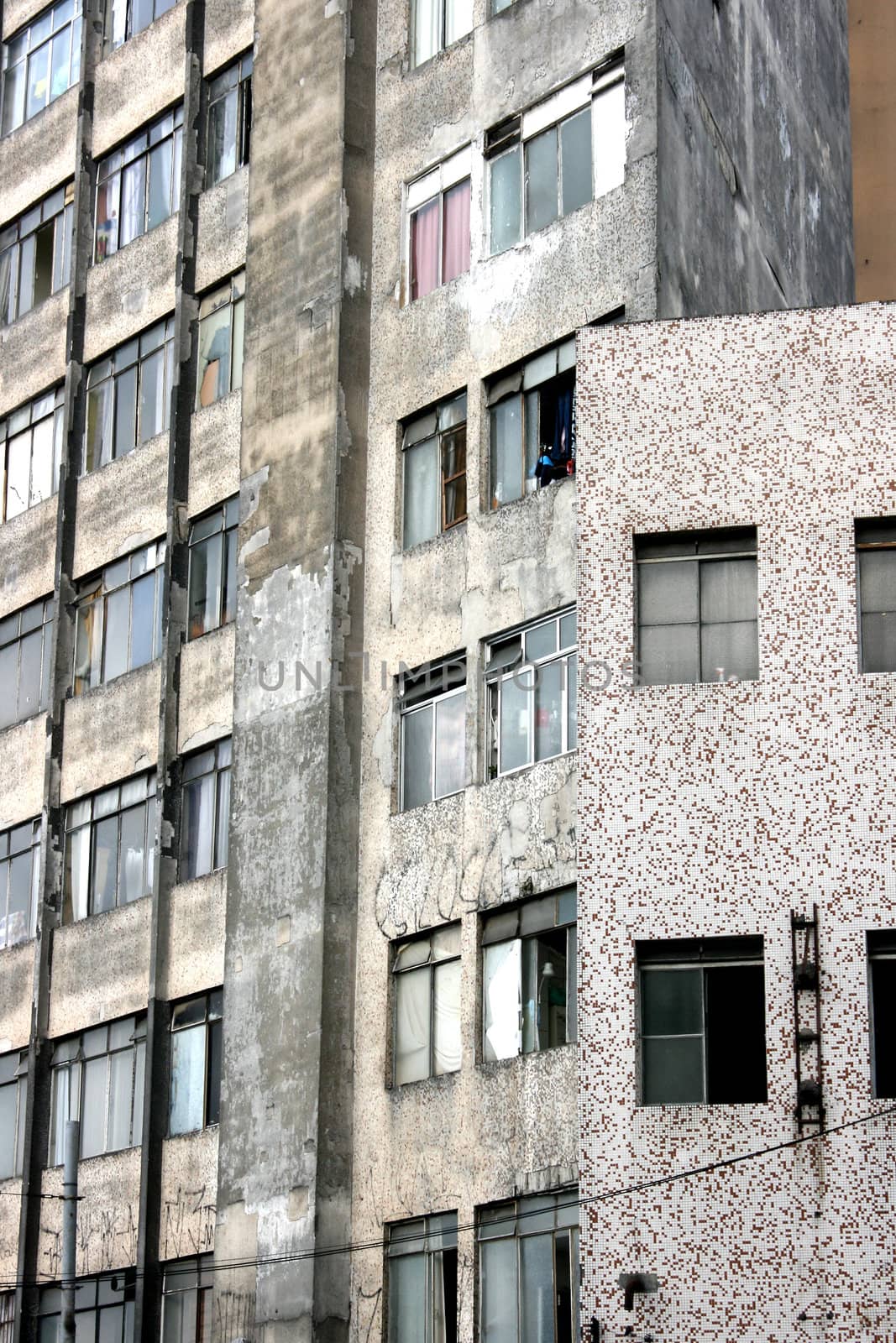 Facade of a rundown building in a poor neighborhood in the center of Sao Paulo, Brazil.