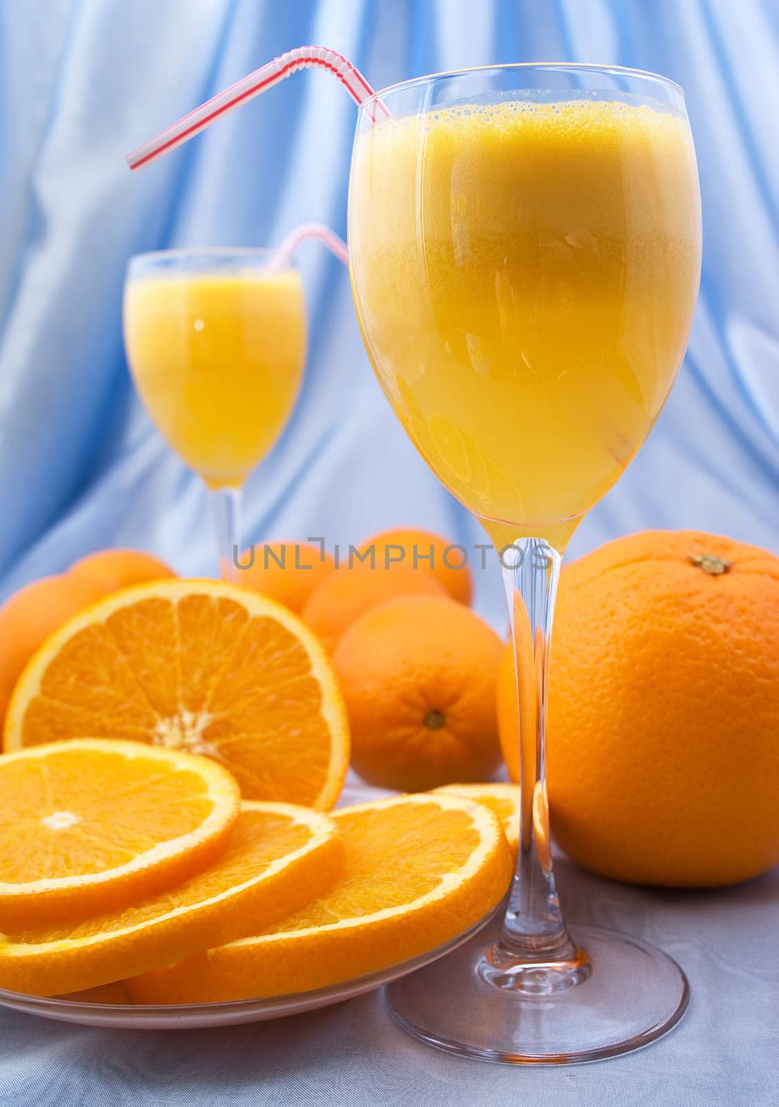 Close-up of glass of fresh orange juice by BIG_TAU