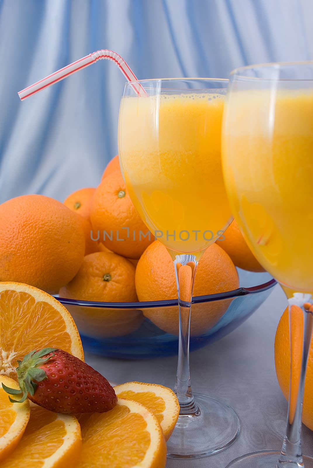 Close-up of two crystal glass of fresh orange juice