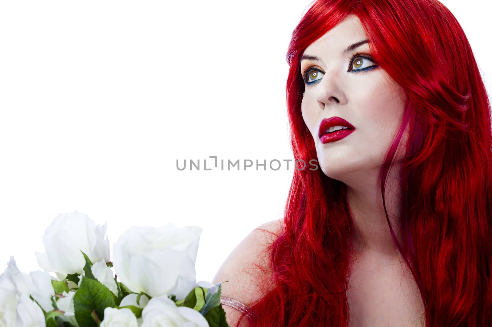 A beautiful fiery red haired woman with white rose. Spring concept