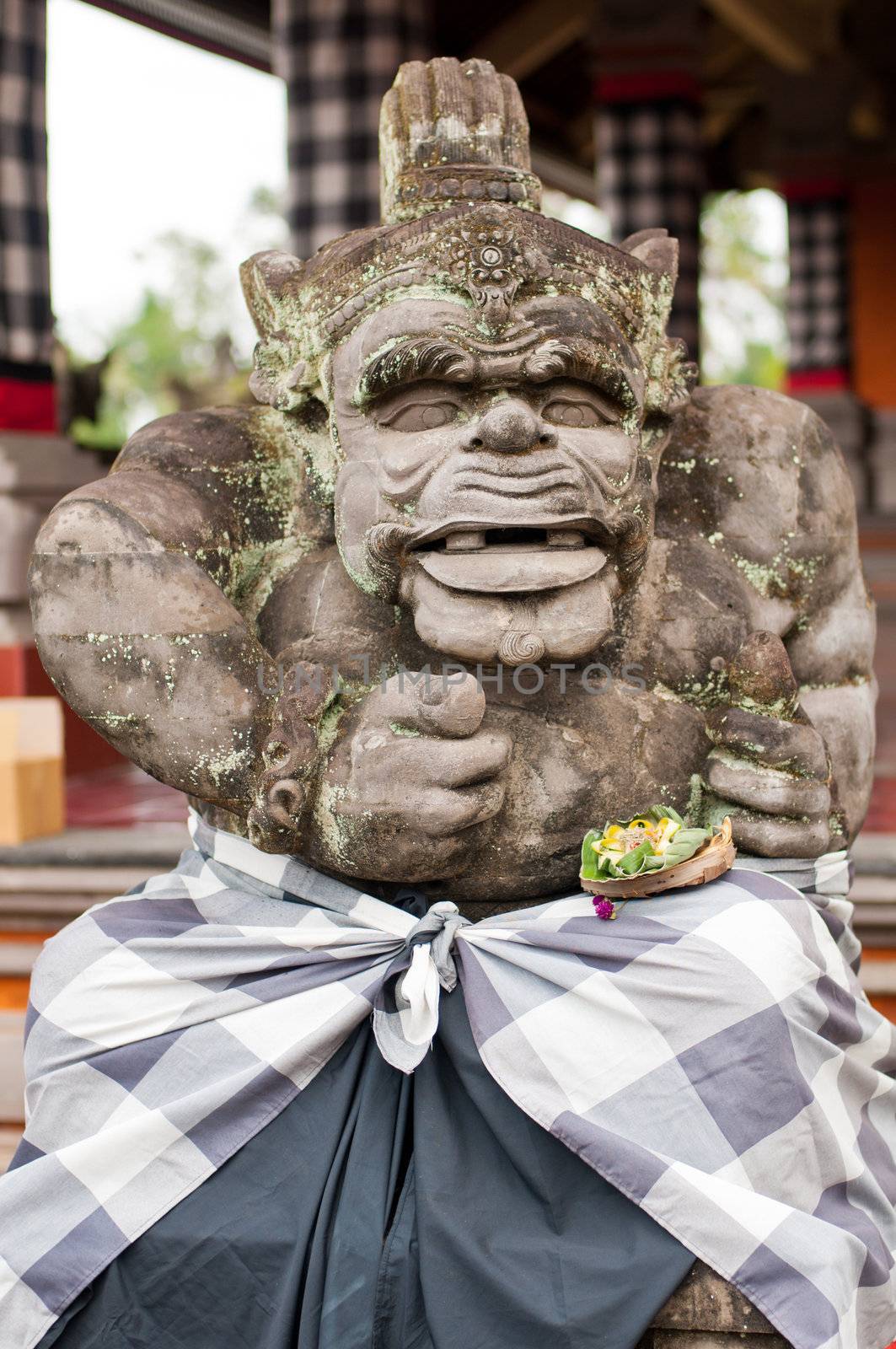 Statue of Balinese demon in Ubud, Indonesia by nvelichko