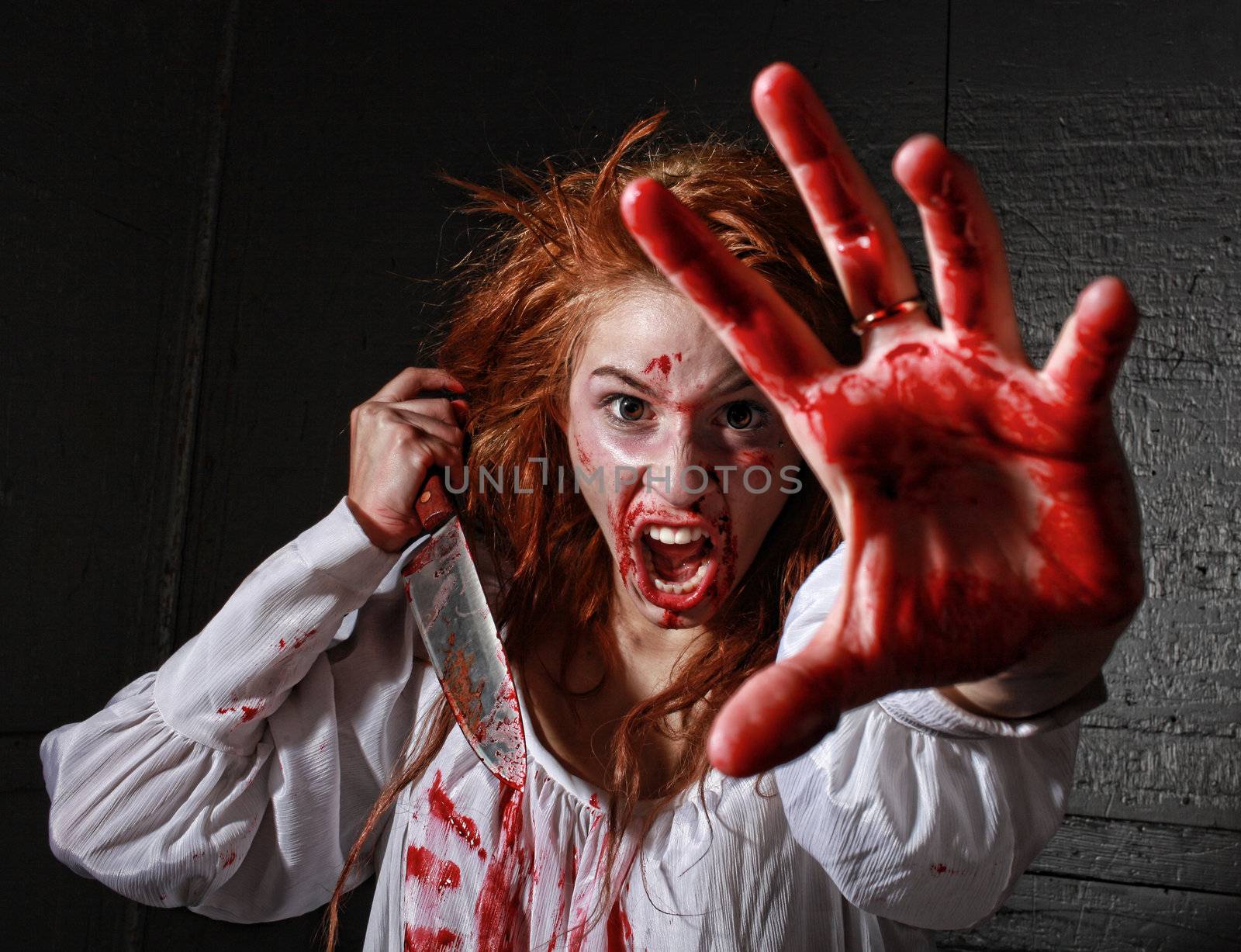 Horror Themed Image With Bleeding Freightened Woman by tobkatrina