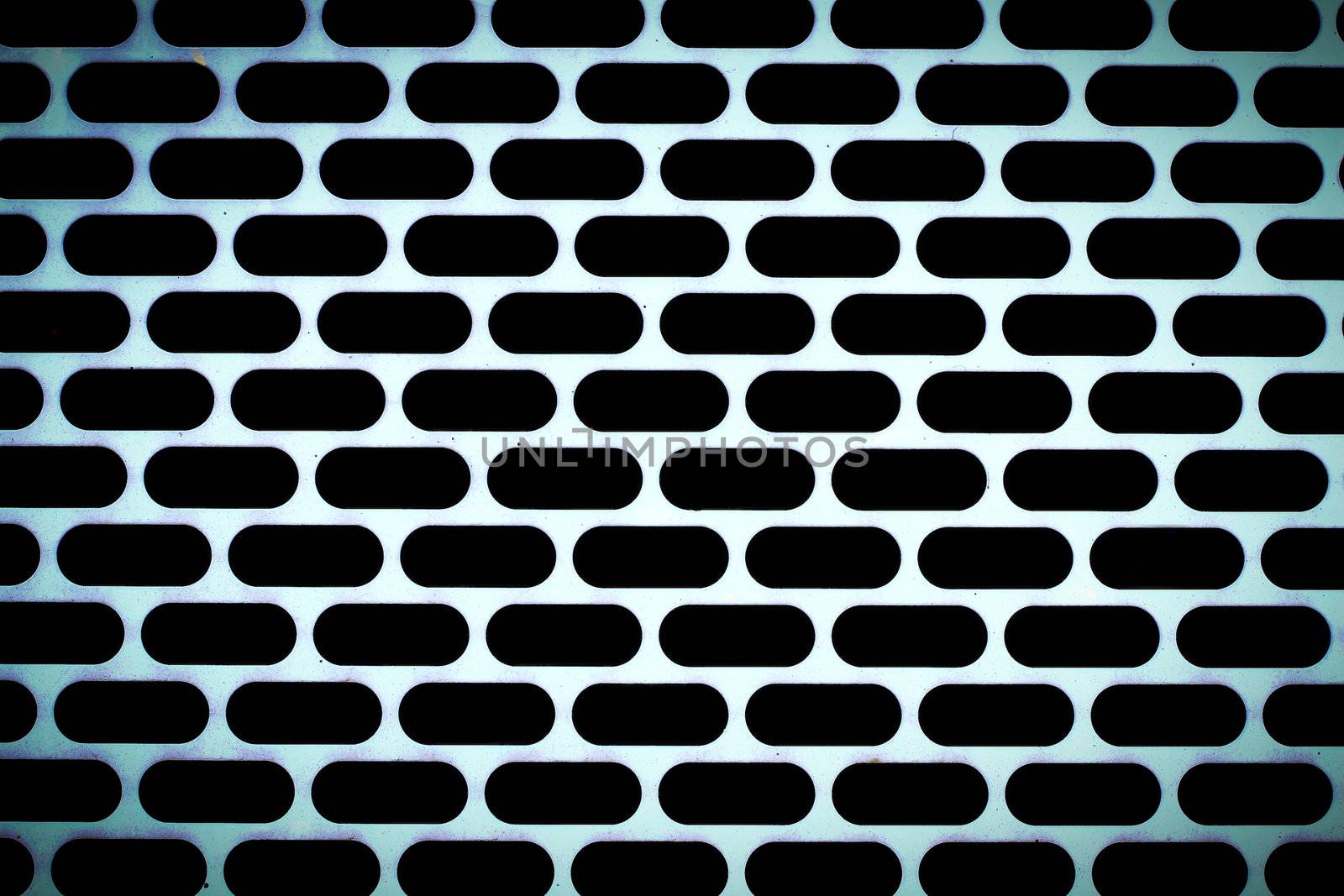 metal background with perforated holes by rufous