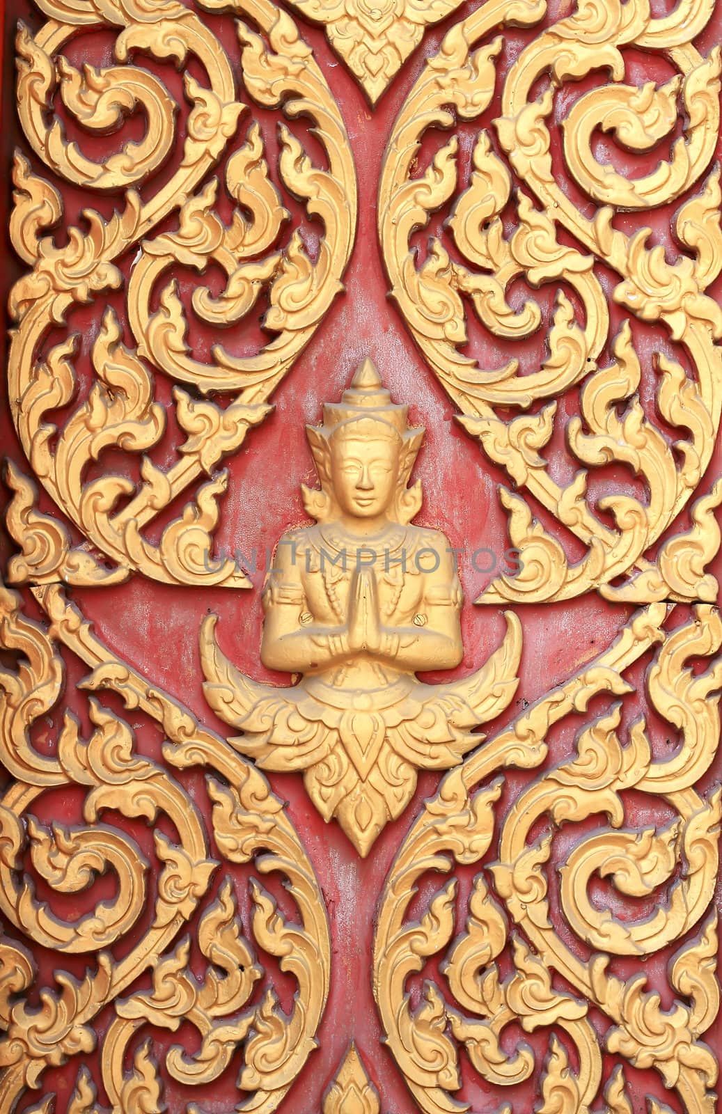 raditional thai style art carving at the door of temple