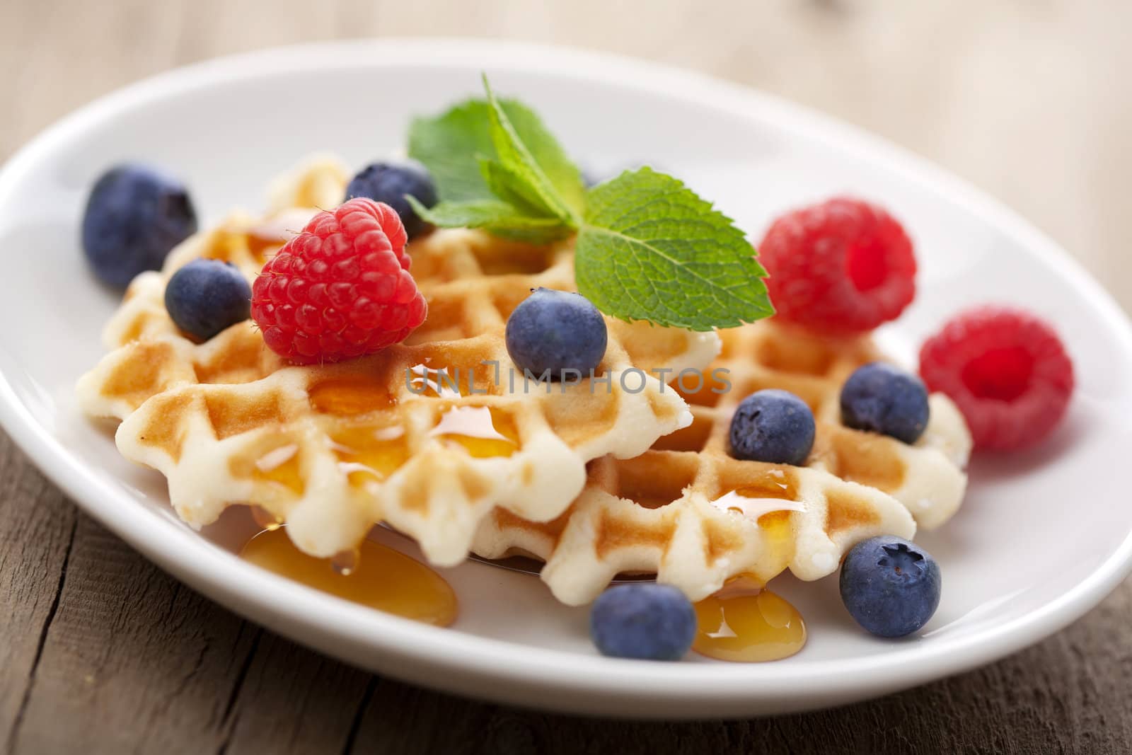 waffles with fresh berries and honey 
