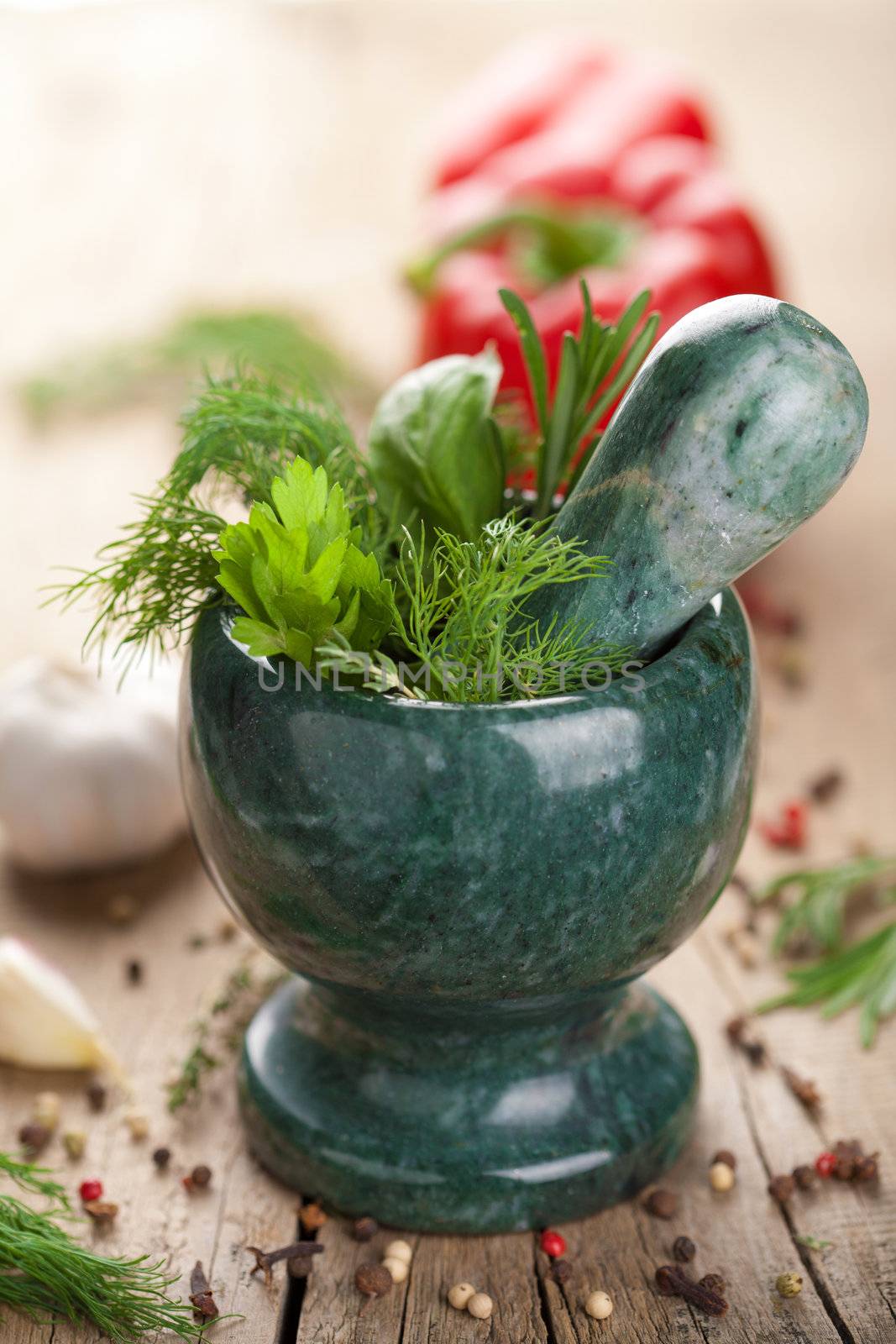mortar with fresh herbs 