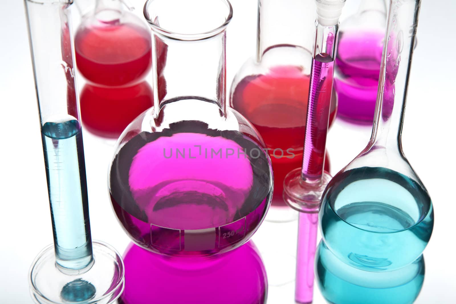 laboratory glassware with colorful chemicals 