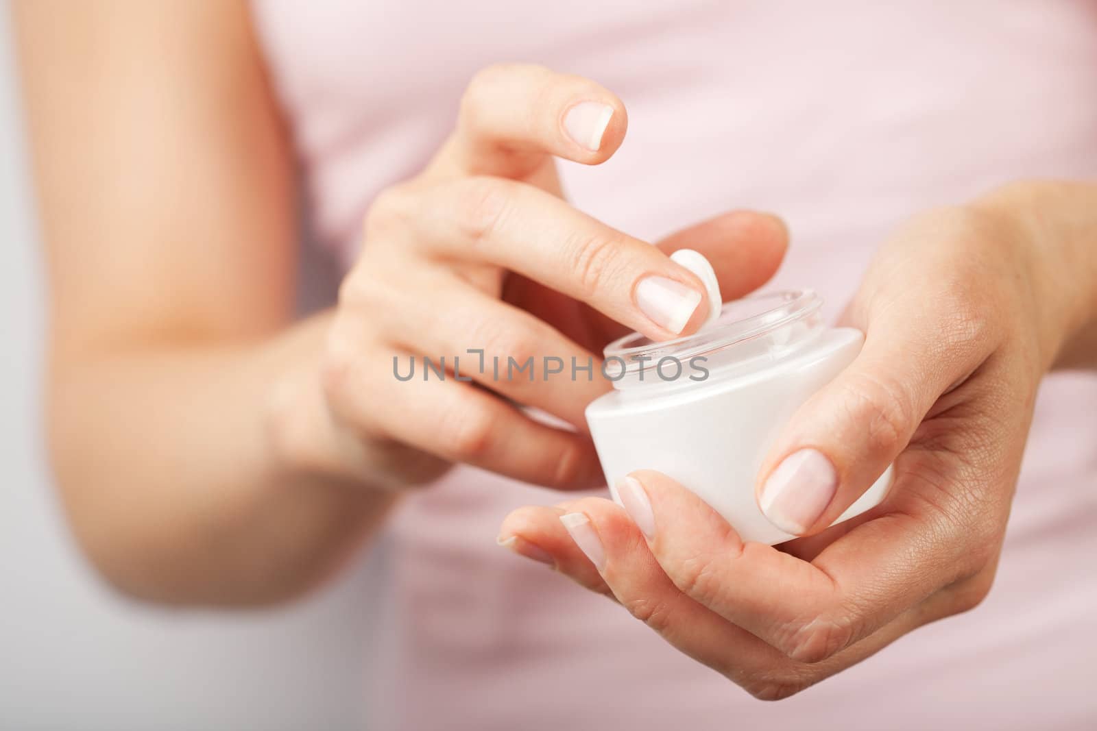 beautiful woman hands with cream 