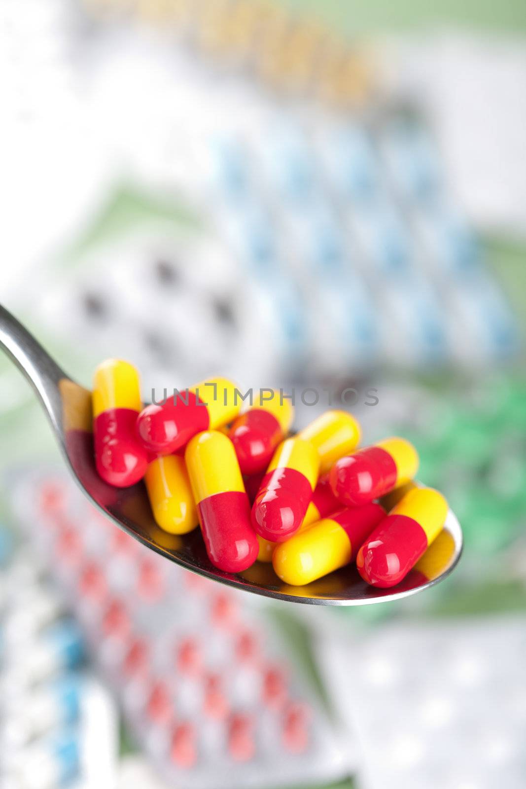 capsule pills in spoon