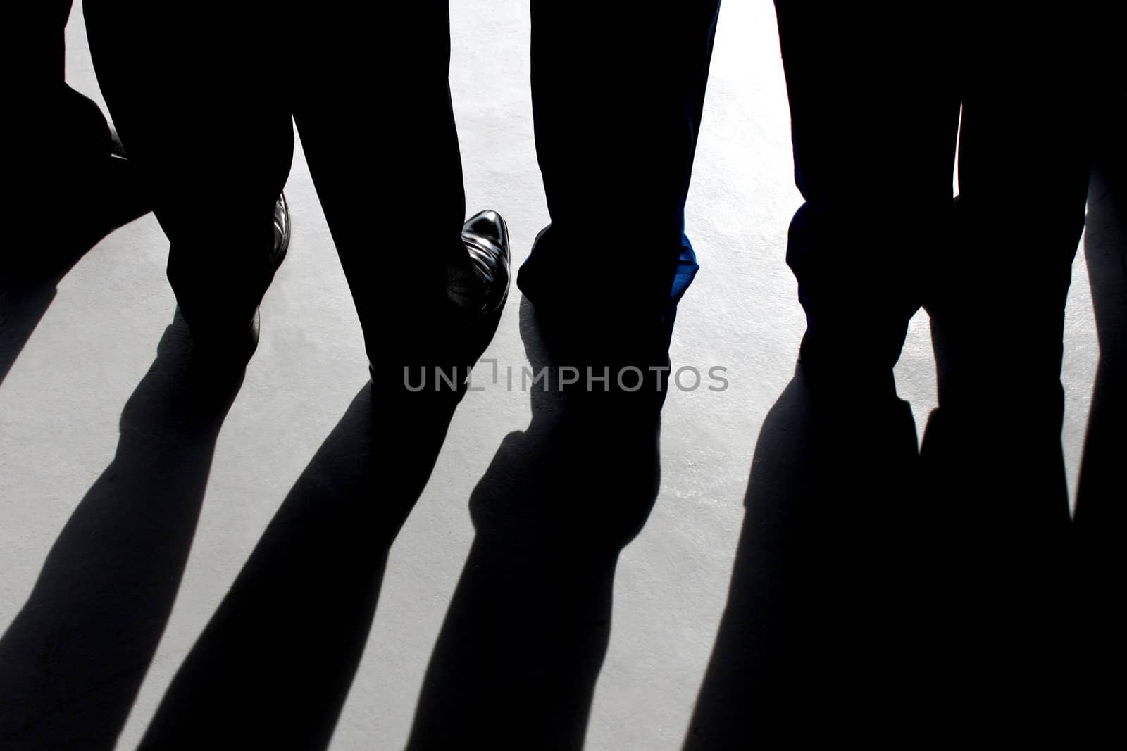 Shadows of  young boys on their graduation black pants