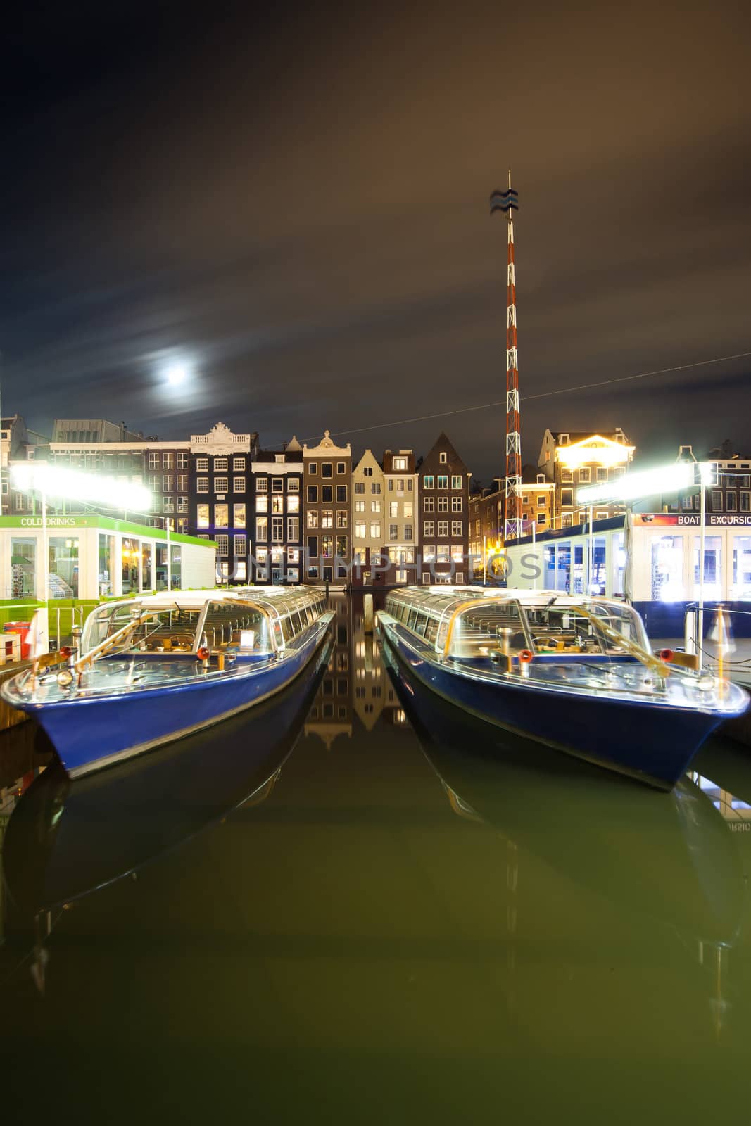 Amsterdam by night - excursion boat quay - photo taken at ultra wide angle