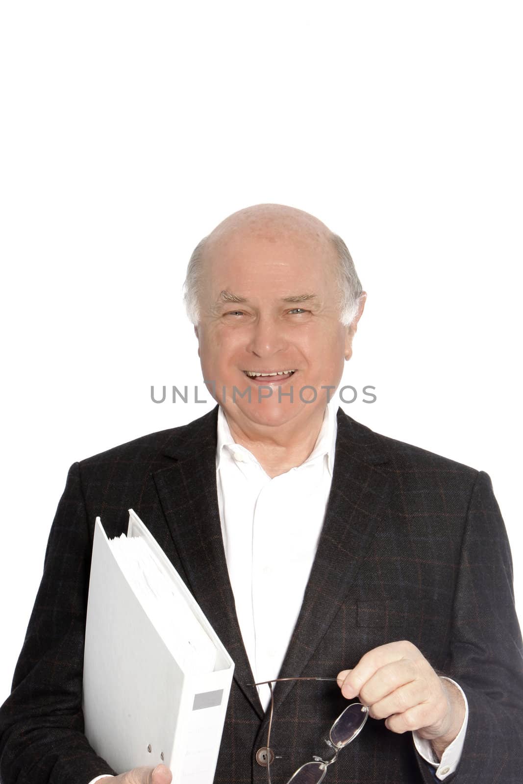 Smiling happy senior man holding a large white folder under his arm, isolated on white