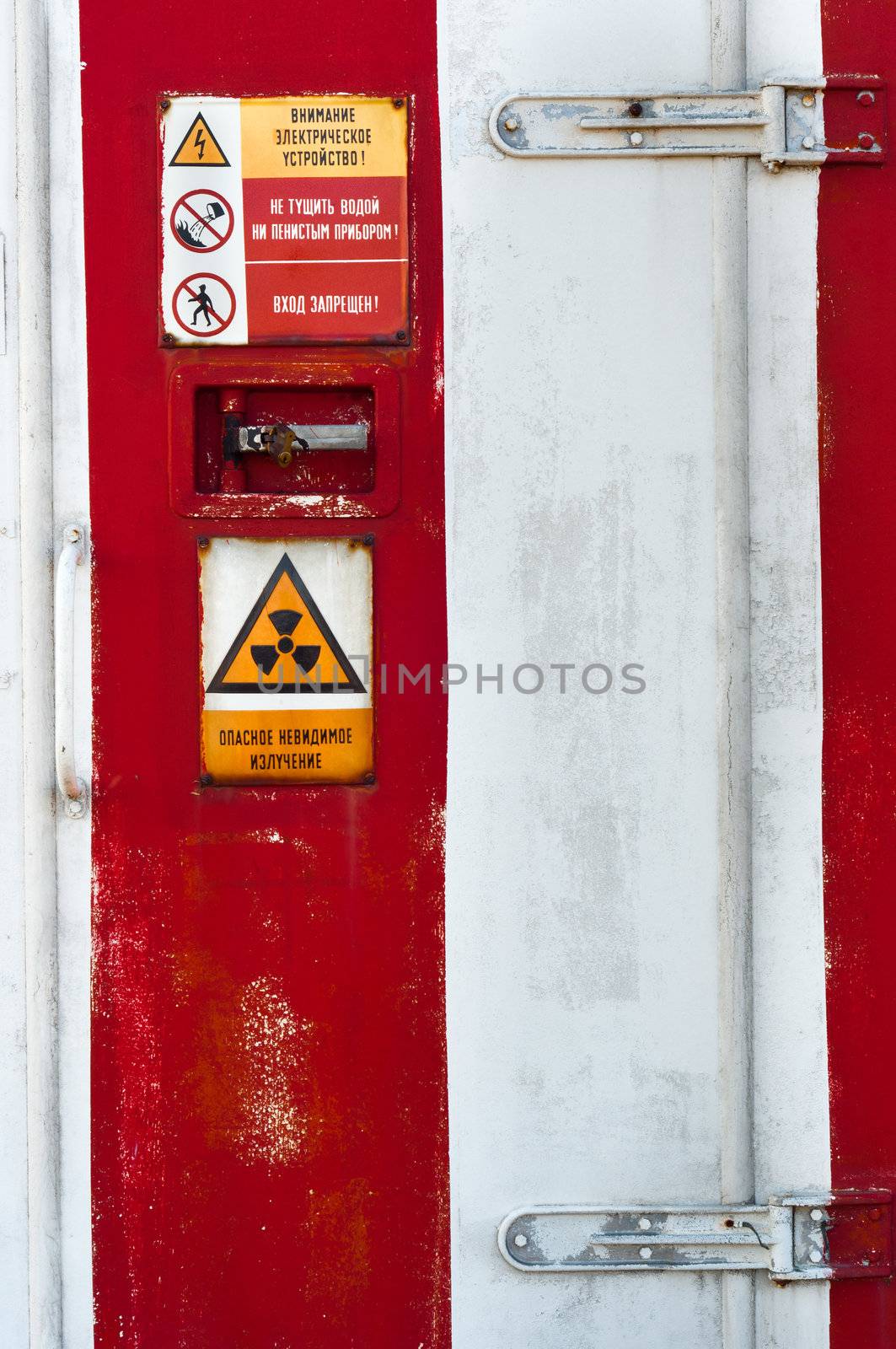 Closed Door of a nuclear facility with signs on it