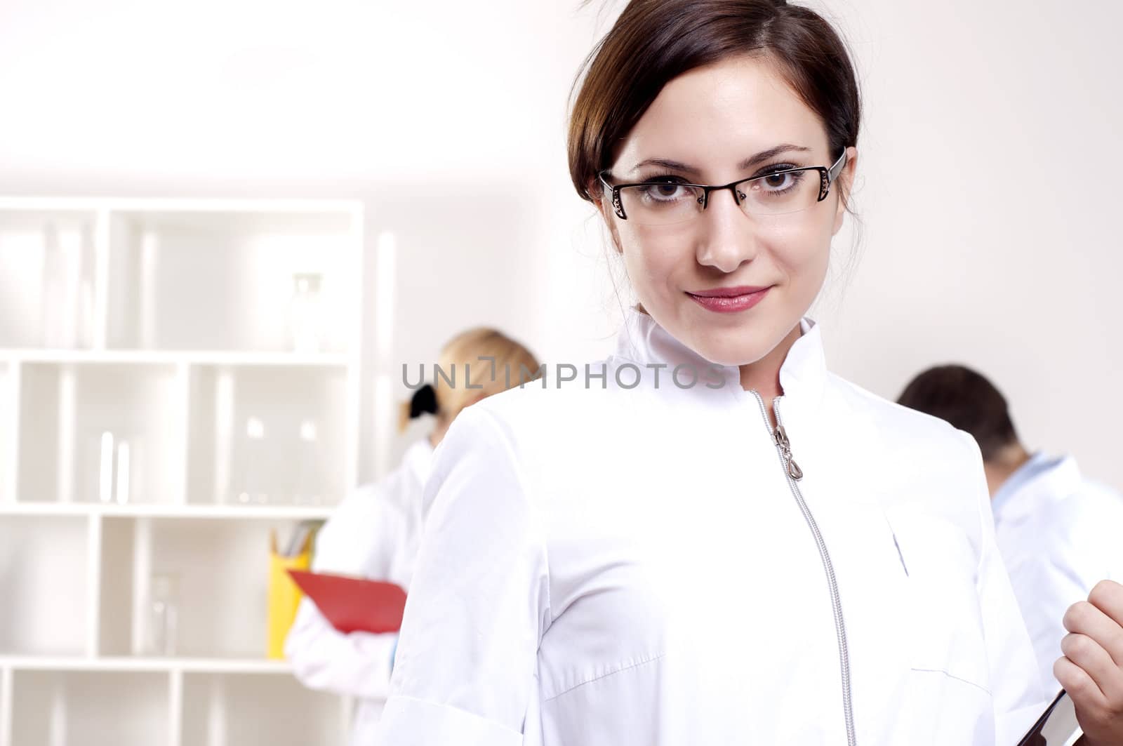 portrait of doctor, holds a tablet in the office