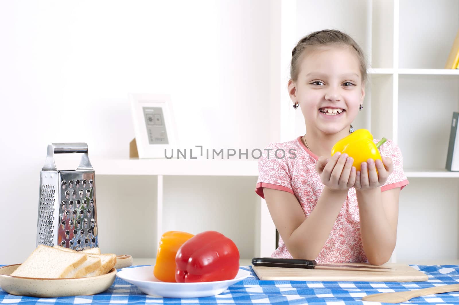 girl working in the kitchen cutting vegetables by adam121