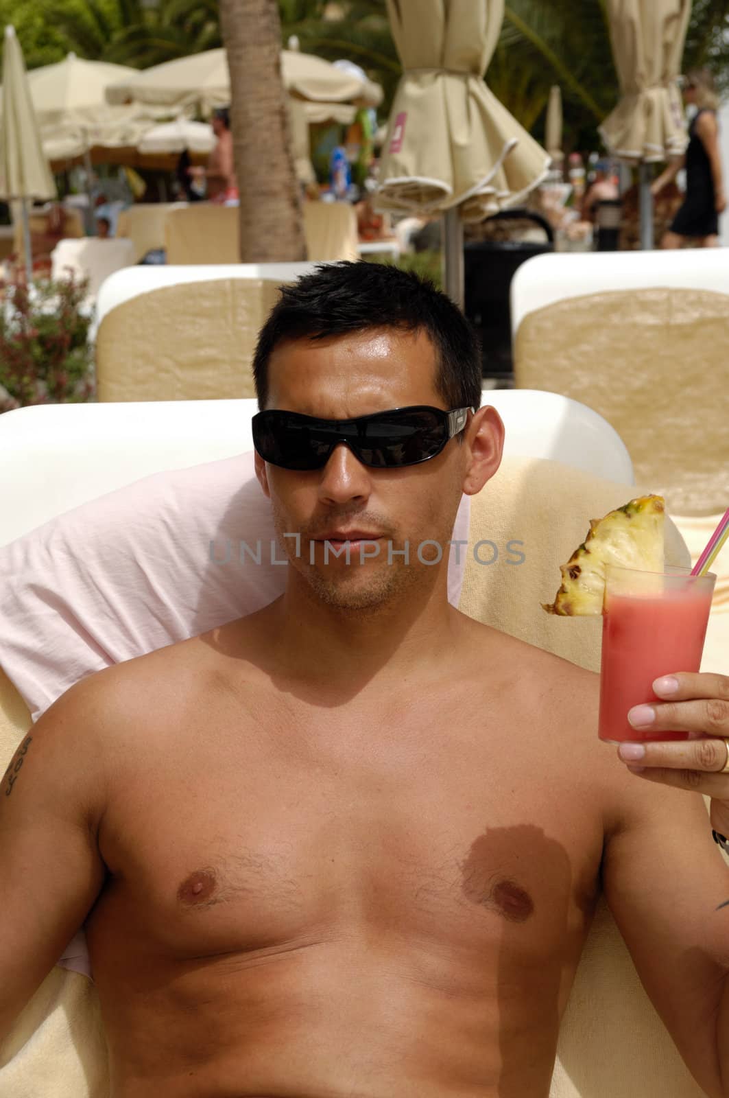 Man holding drink by cfoto